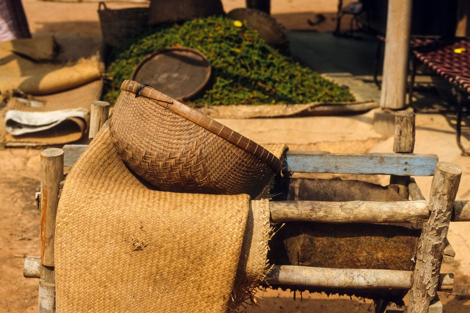 Traditional woven baskets and handcrafted items displayed on wooden surface.