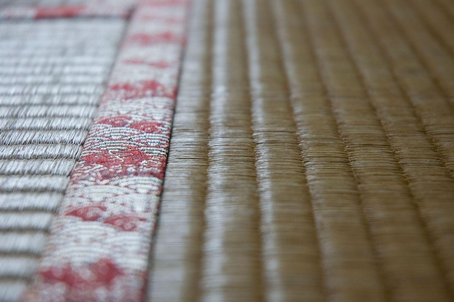 Close-up detail of traditional tatami mat texture showing woven straw pattern.