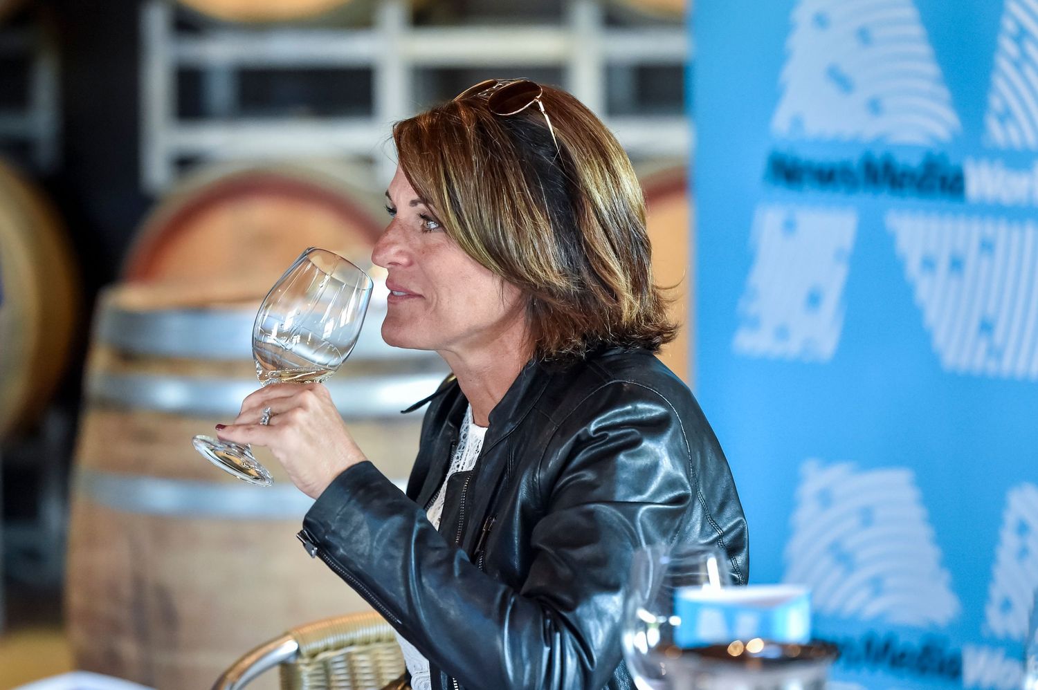 Event attendees enjoying drinks and networking at a social gathering at a winery in the Hunter Valley.
