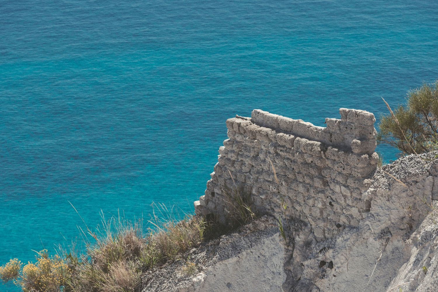 Rocky coastline overlooking turquoise Mediterranean waters.