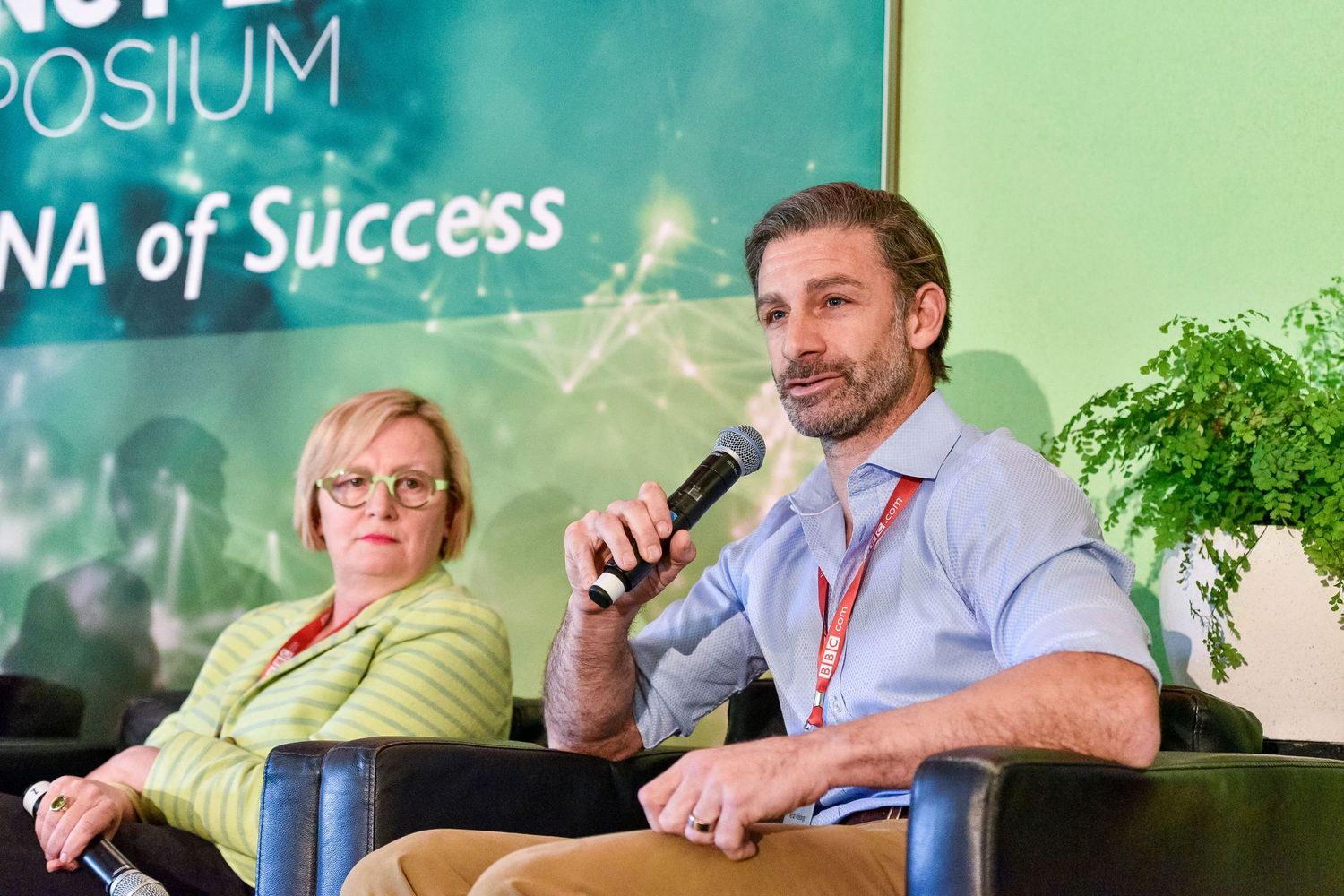 Business professionals participate in a panel discussion at an industry symposium event Rydges Hotel & Resorts.