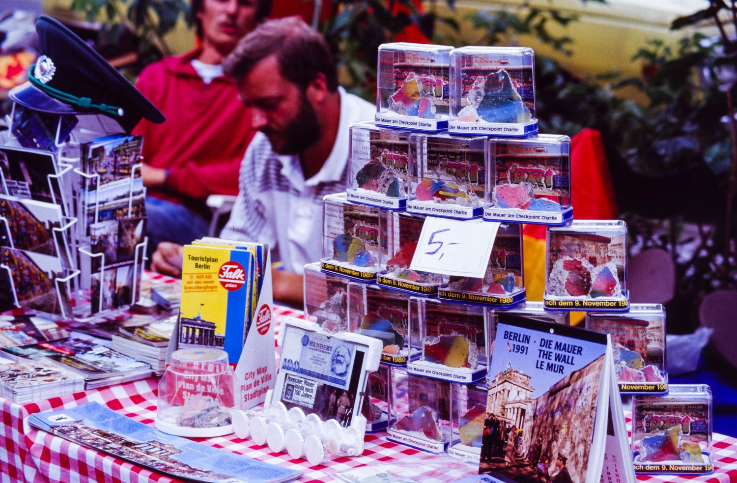 Display of merchandise and memorabilia at an outdoor market or vendor stall.