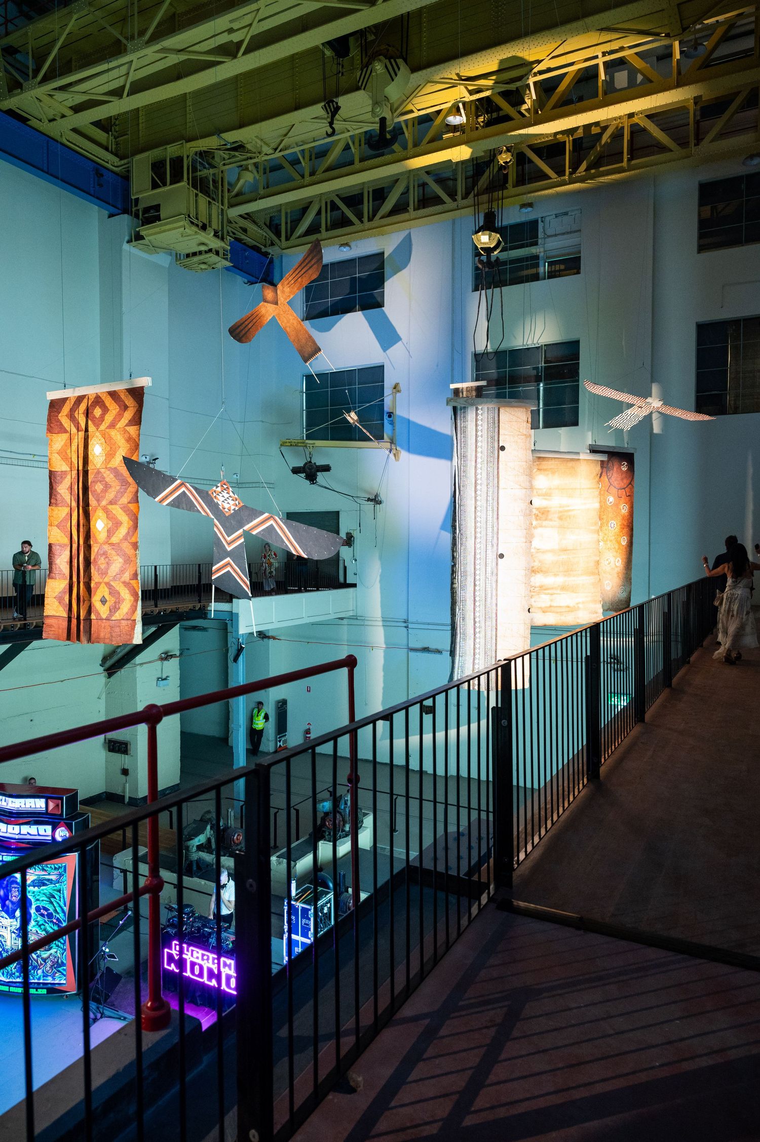Biennale of Sydney White Bay Power Station, art installation with illuminated sculptures and railings in a blue-tinted industrial space.