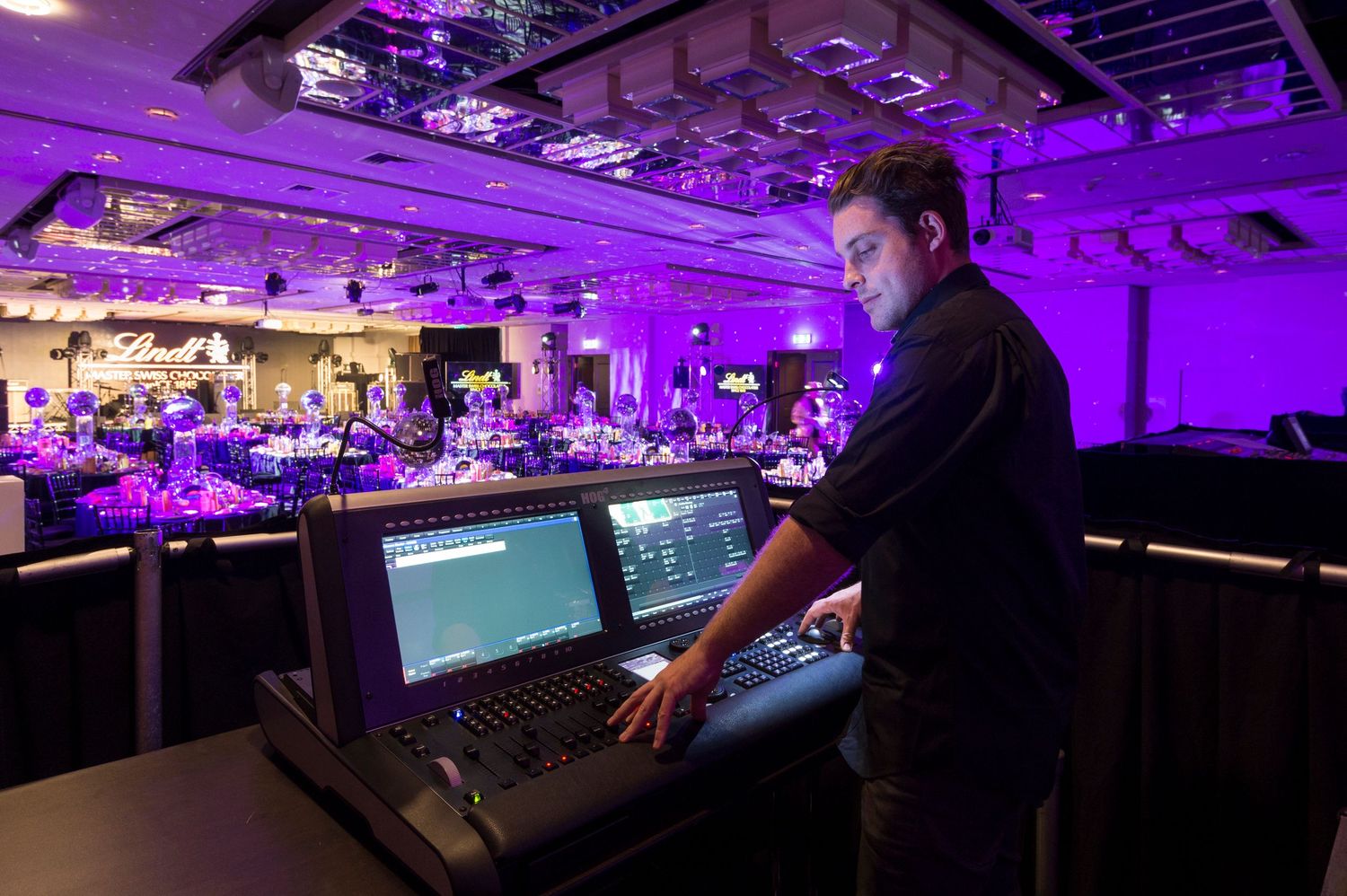 A series of images showing a purple-lit event space with technical control panels and production equipment.