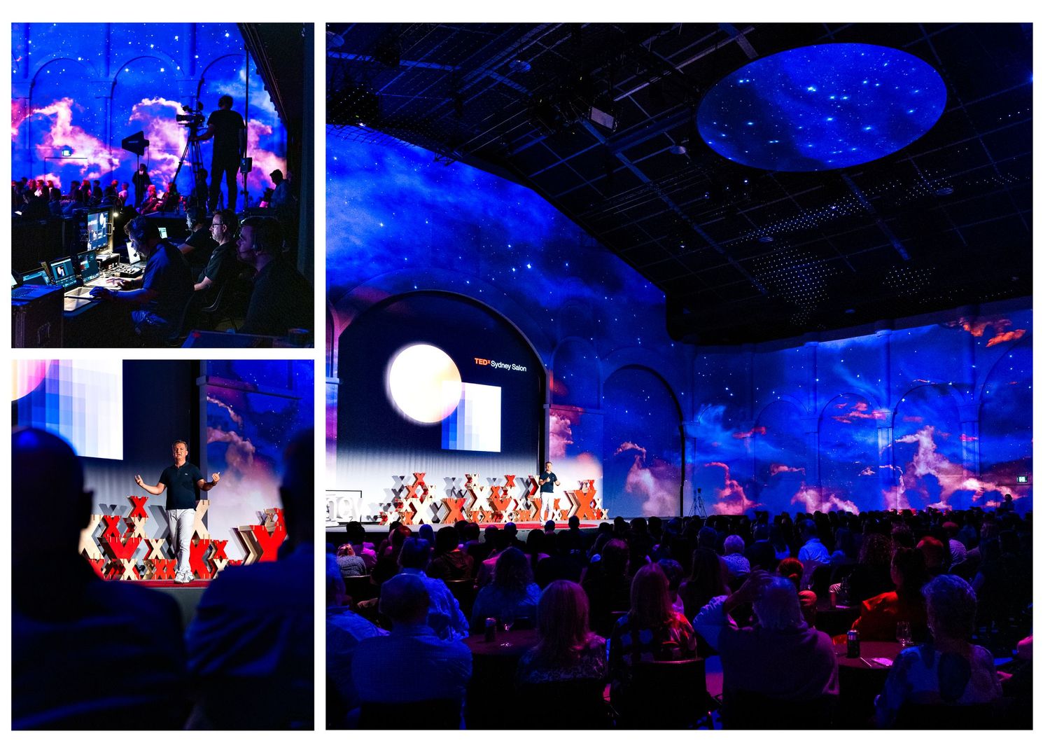 A large conference event with blue cosmic projections, a speaker on stage, and an audience seated in a grand venue.