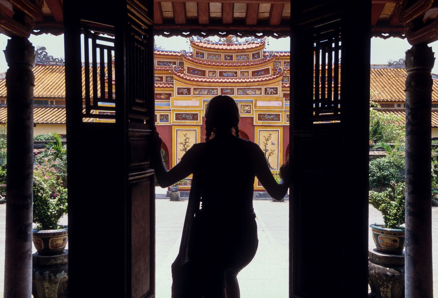 Silhouetted temple architecture with traditional Asian design elements.