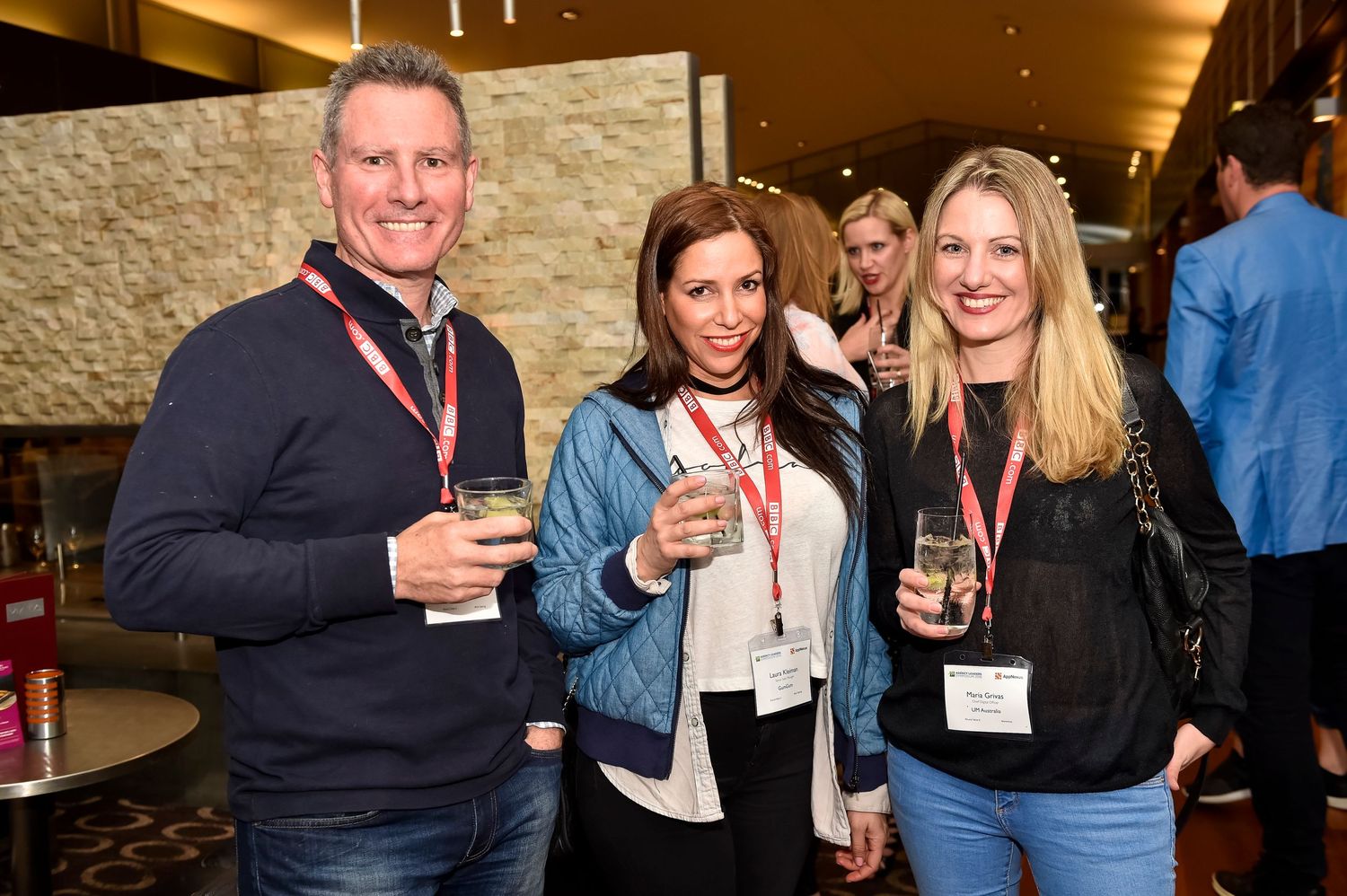 Business professionals socializing at an evening networking reception.