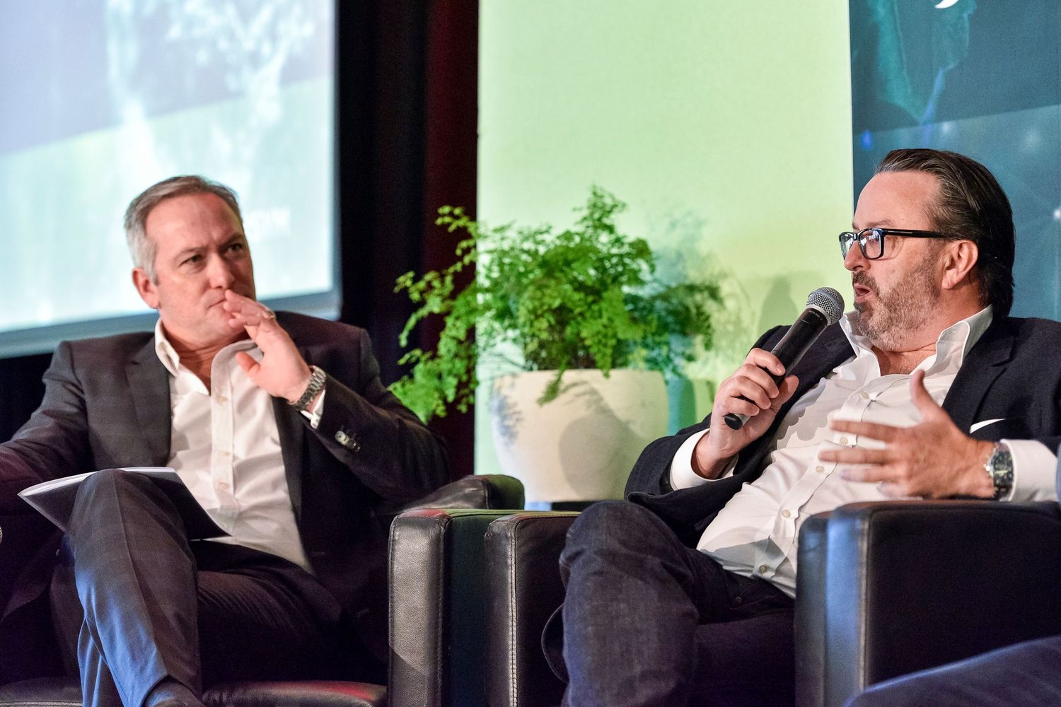 Professional panel participants engaged in discussion at conference roundtable.
