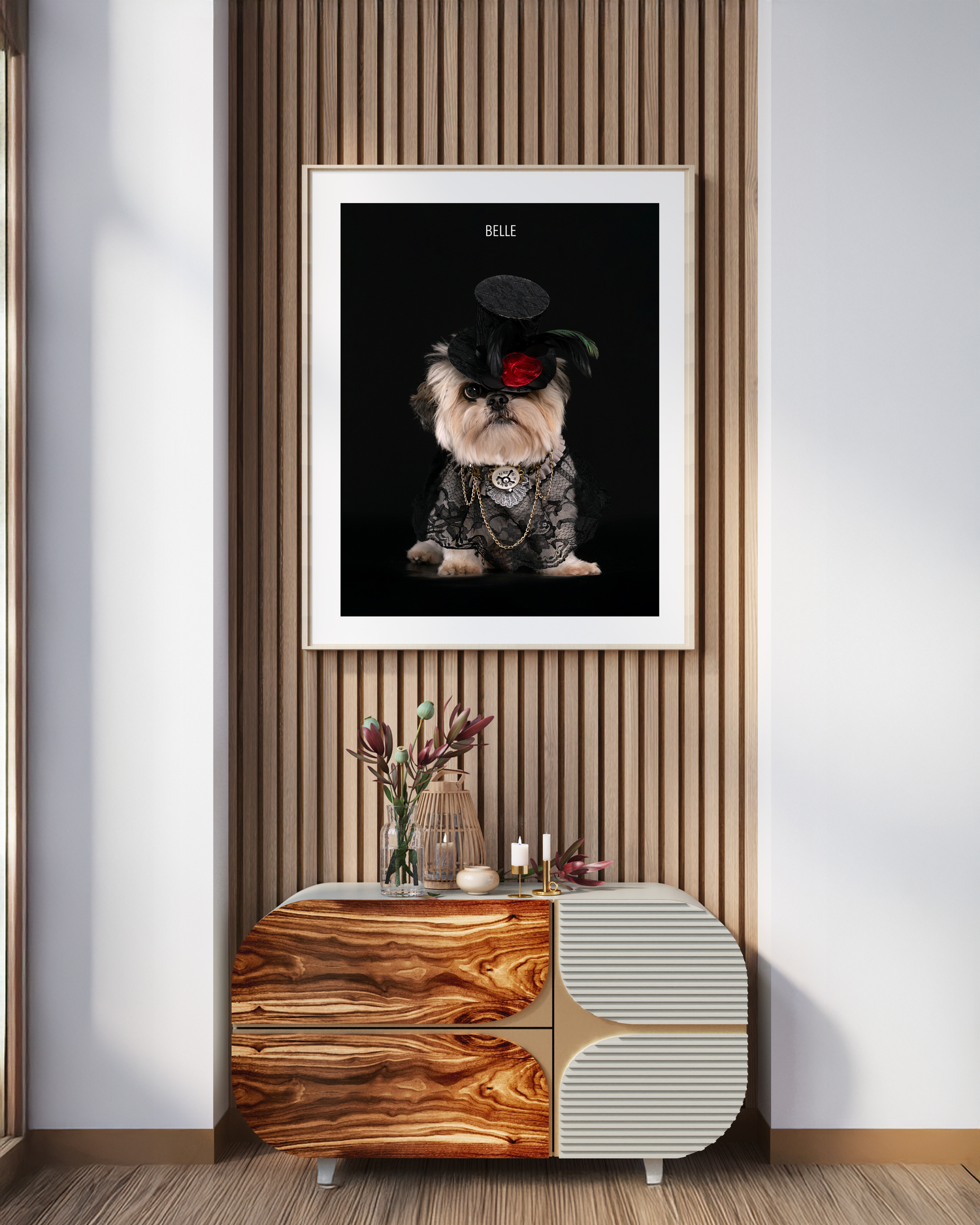 Framed portrait print of Belle the Shih Tzu in gothic lace and top hat displayed above a modern wooden sideboard.