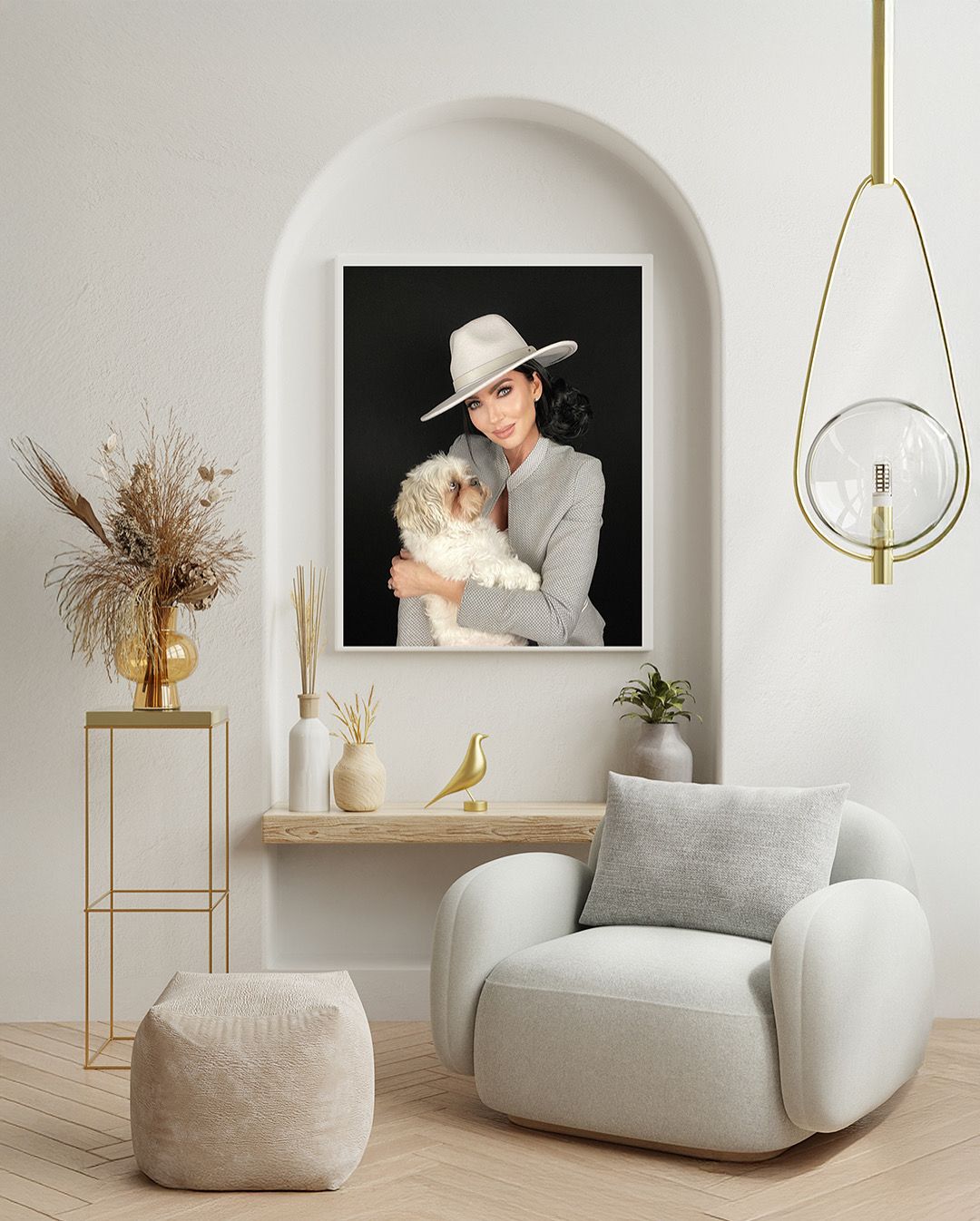 Framed wall art of smiling woman in white hat embracing fluffy dog in elegant minimalist living room.