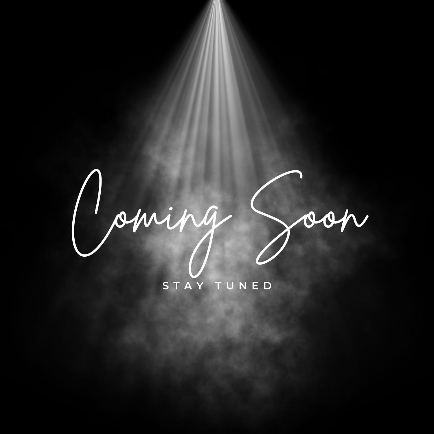 Dramatic spotlight shining down on Coming Soon Stay Tuned text with misty smoke effect on black background.