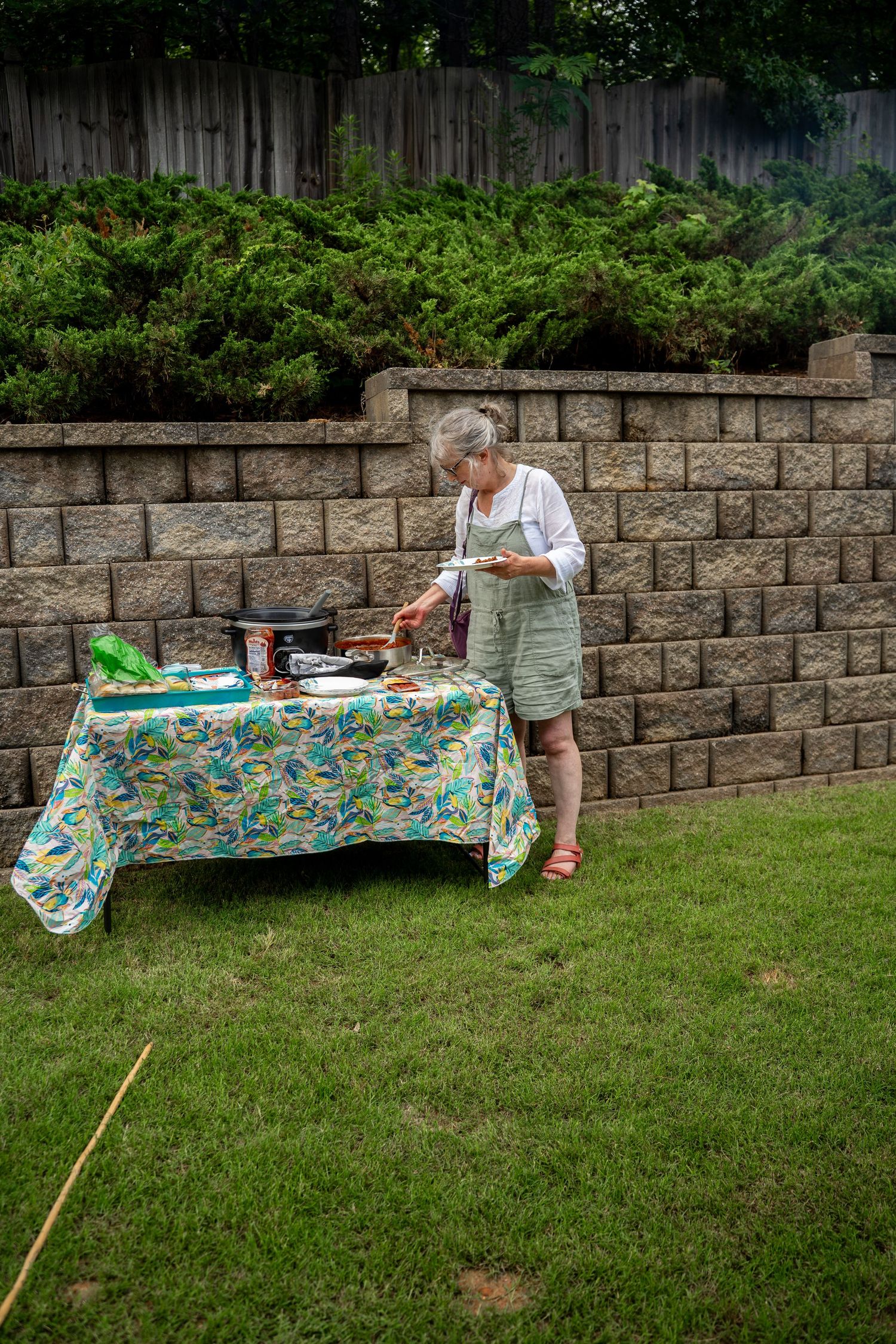 Lady serving herself food outside