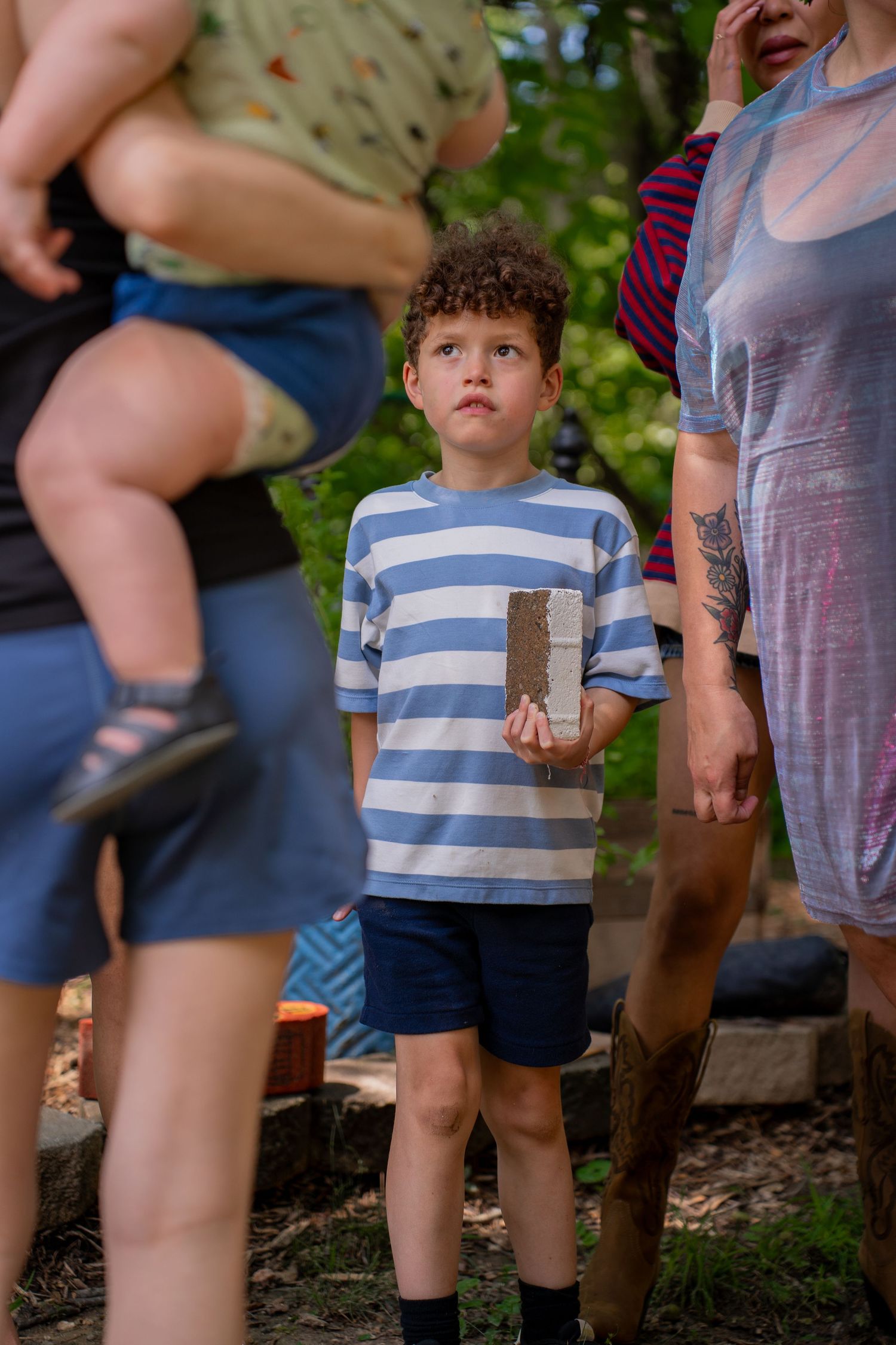 Child looking up at adults