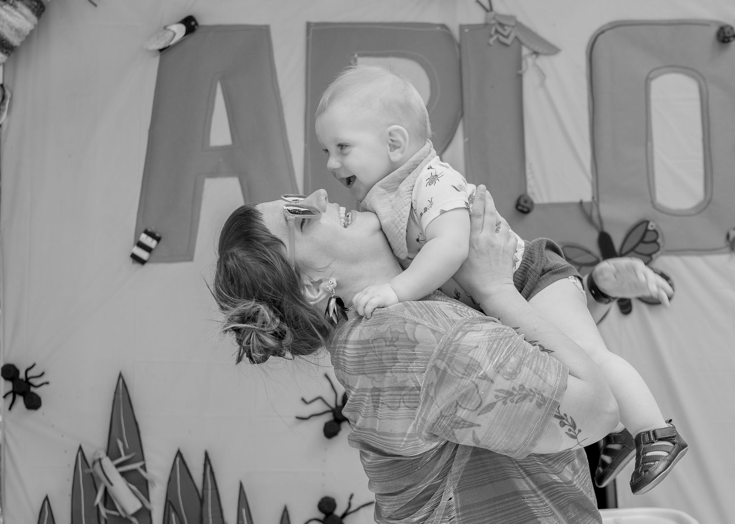 Toddler laughing with mum