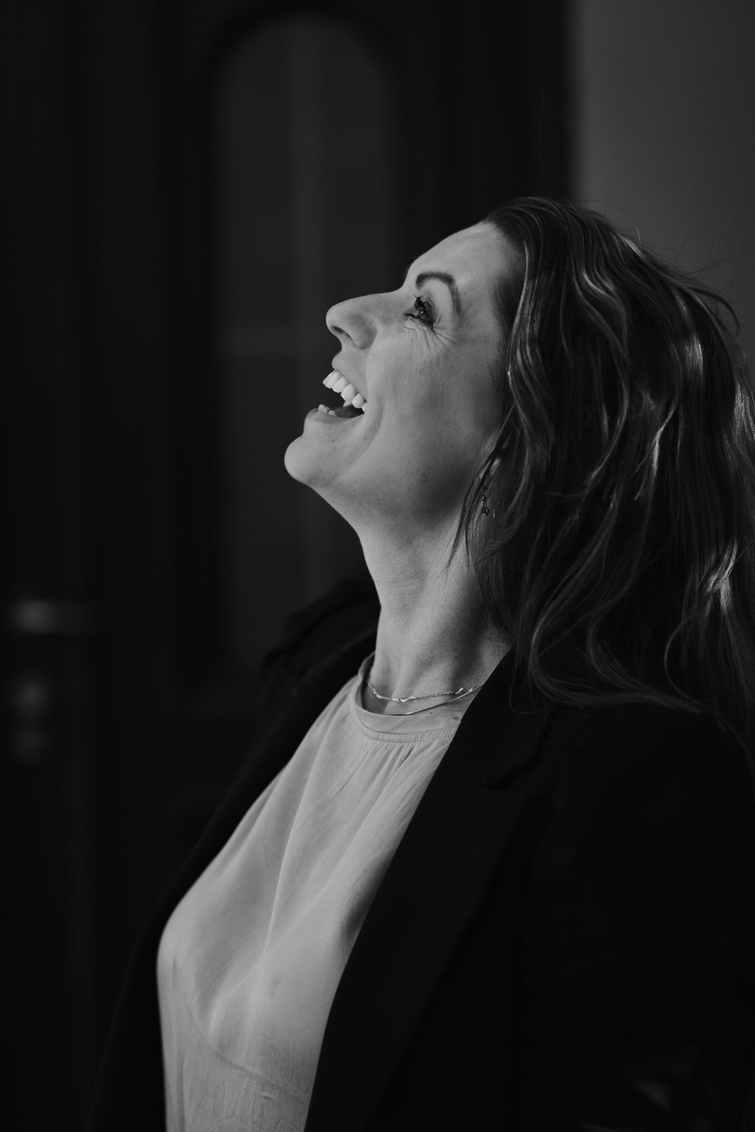 A dramatic black and white portrait series showing upward glancing expressions.