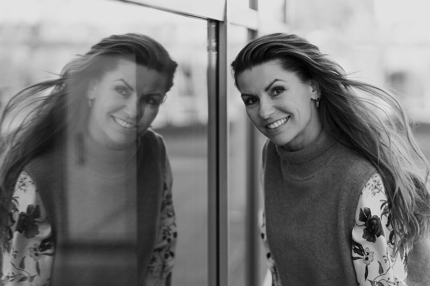 A series of black and white portraits showing natural expressions and movement.
