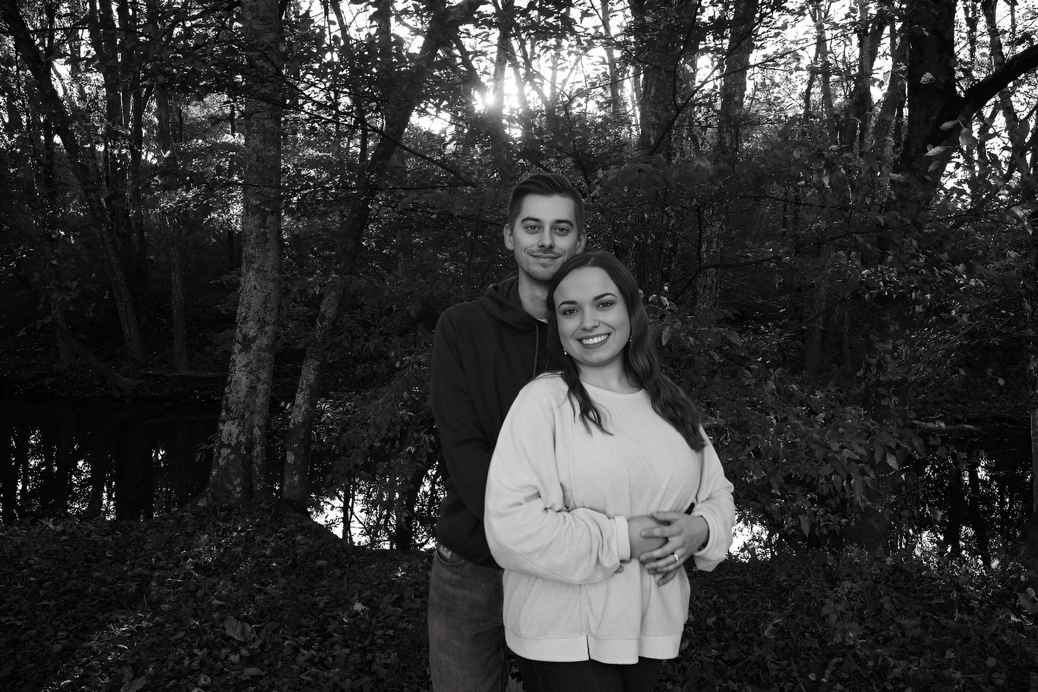 A romantic photoshoot sequence captured in a wooded forest setting.