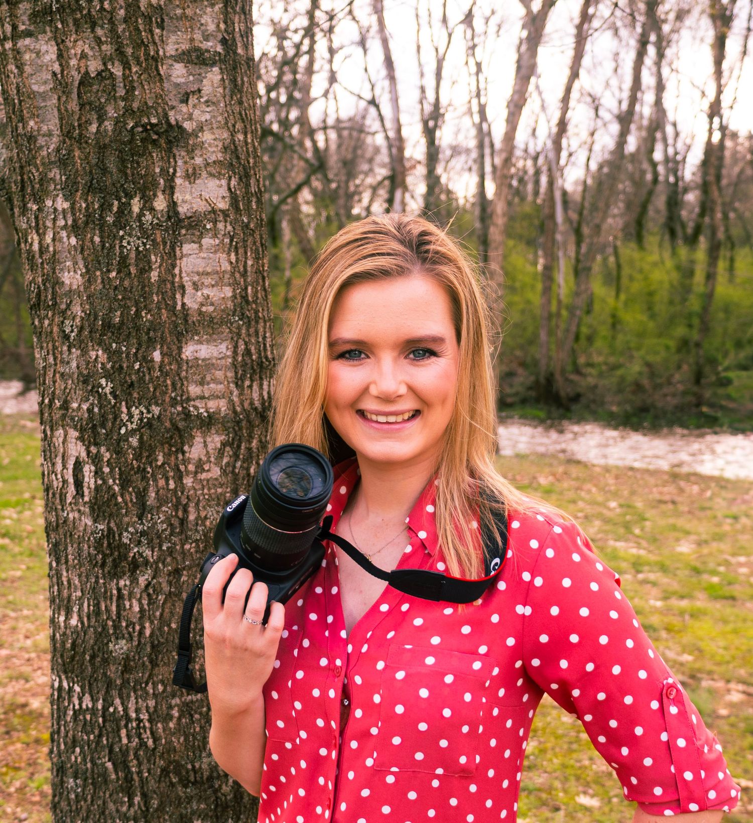 A series of five photos shows someone in a red polka dot dress posing with a camera against a wooded background.