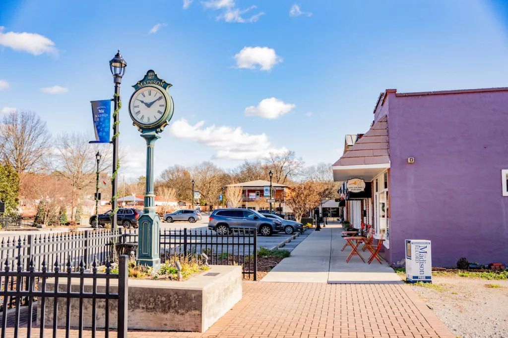 Downtown Madison, Alabama featuring the historic Madison clock and charming storefronts in the city center.