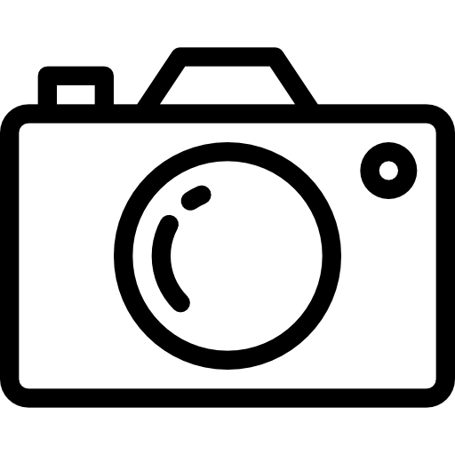 Black and white camera icon with lens, viewfinder, and shutter button, simple outline style graphic.