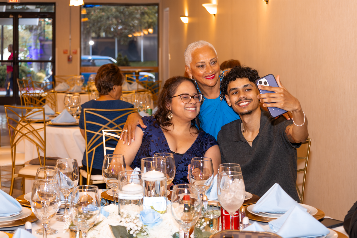 Guests enjoying dinner and conversation at elegant Quinceañera.