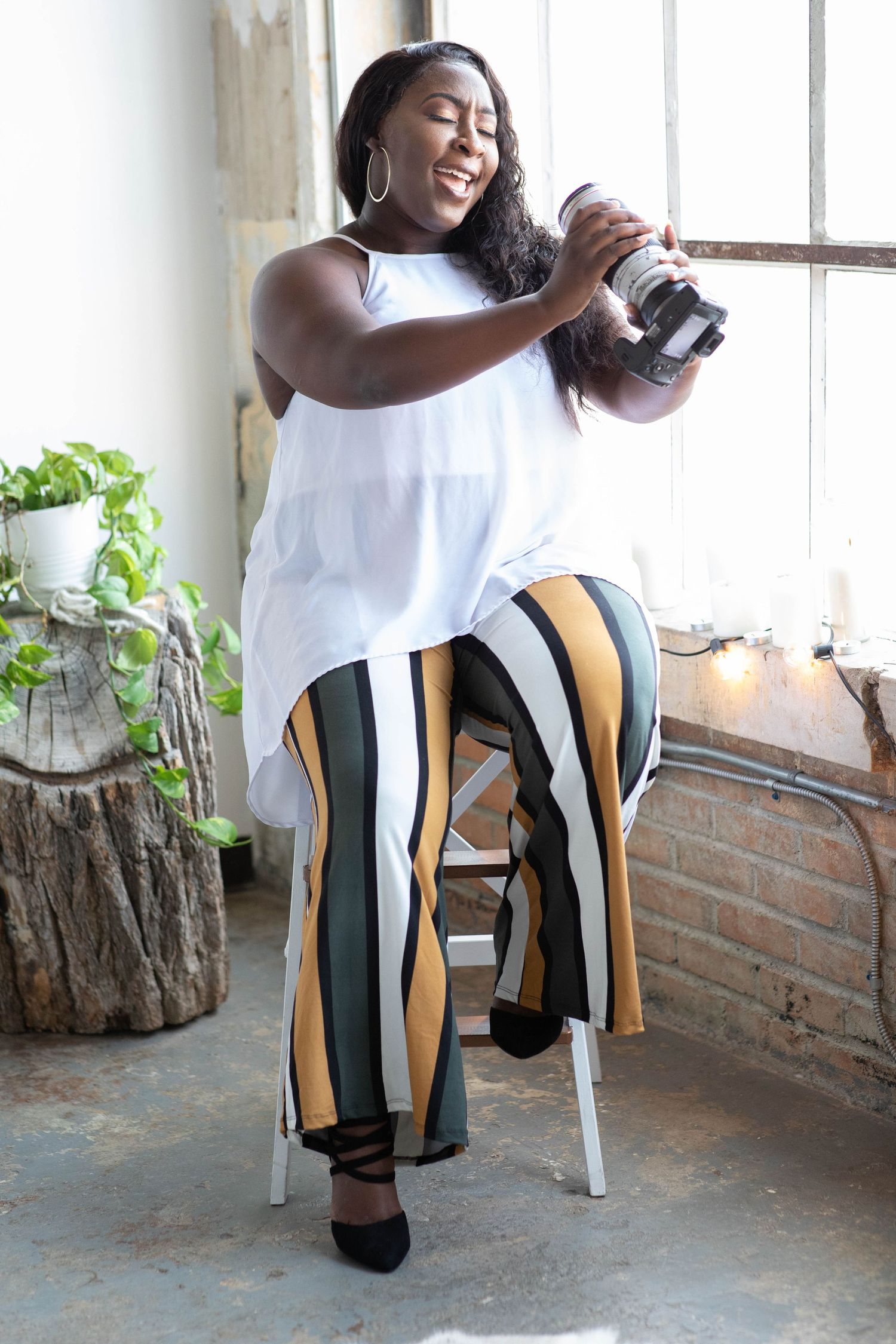 Mari of Studio Mari — Forney TX lifestyle editorial photographer holding camera, DFW portrait & branding photographer