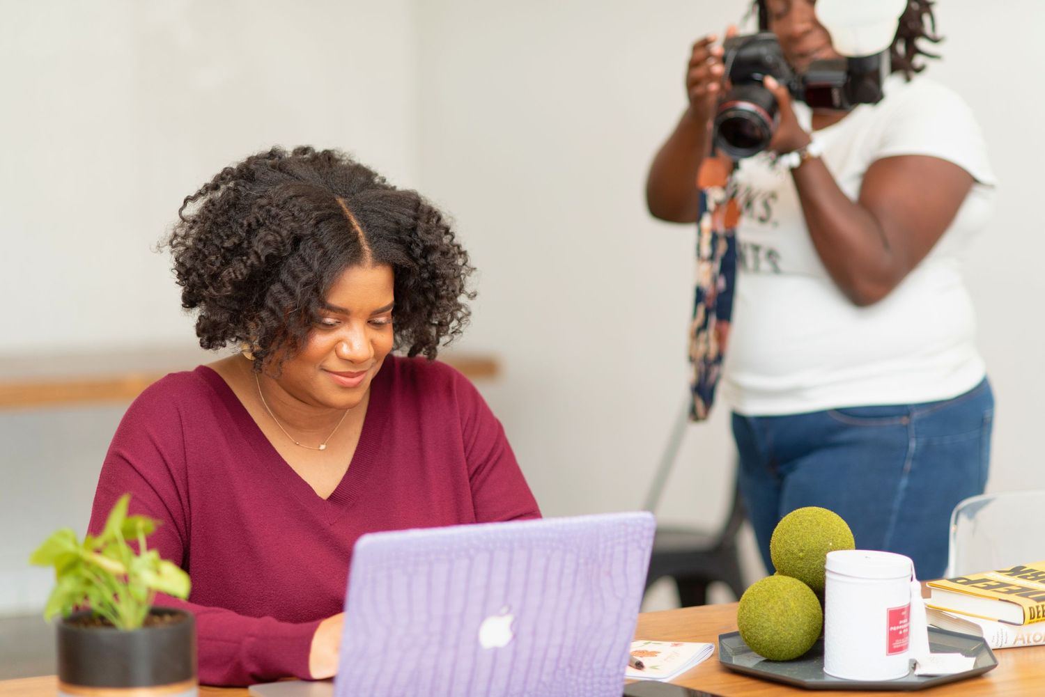 Mari of Studio Mari — Forney TX lifestyle editorial photographer holding camera, DFW portrait & branding photographer