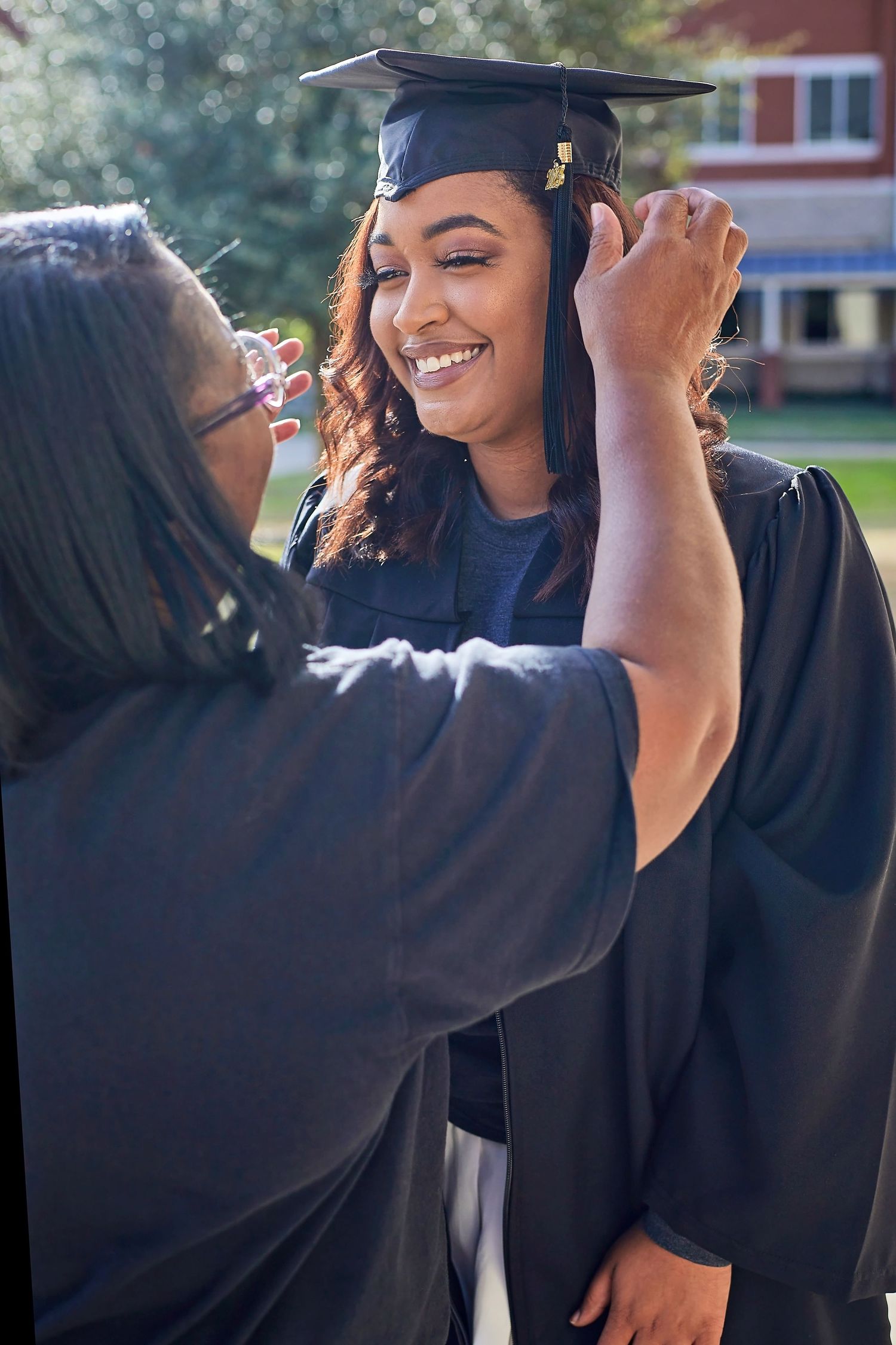 DFW milestone graduation session by Studio Mari — bright vibrant editorial cap gown portrait, Forney TX photographer Mari Jaxn Studio