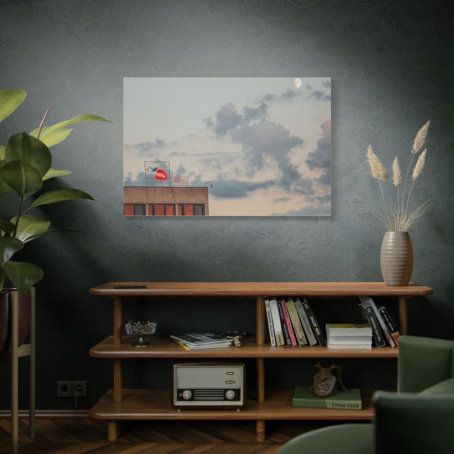Dark green living room interior with wooden bench, vintage radio, and cloudy landscape artwork on the wall.