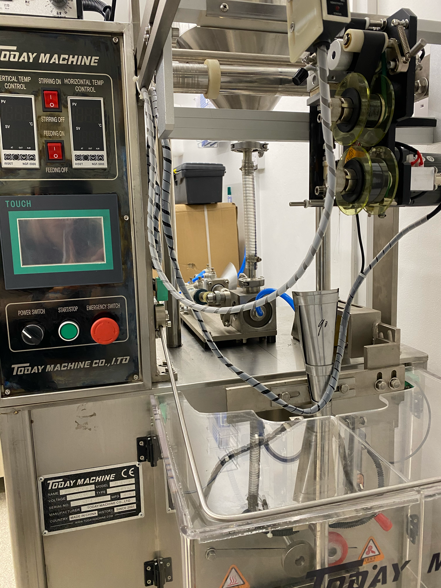 Medical equipment and dialysis machines with digital displays and tubing in a clinical treatment facility.