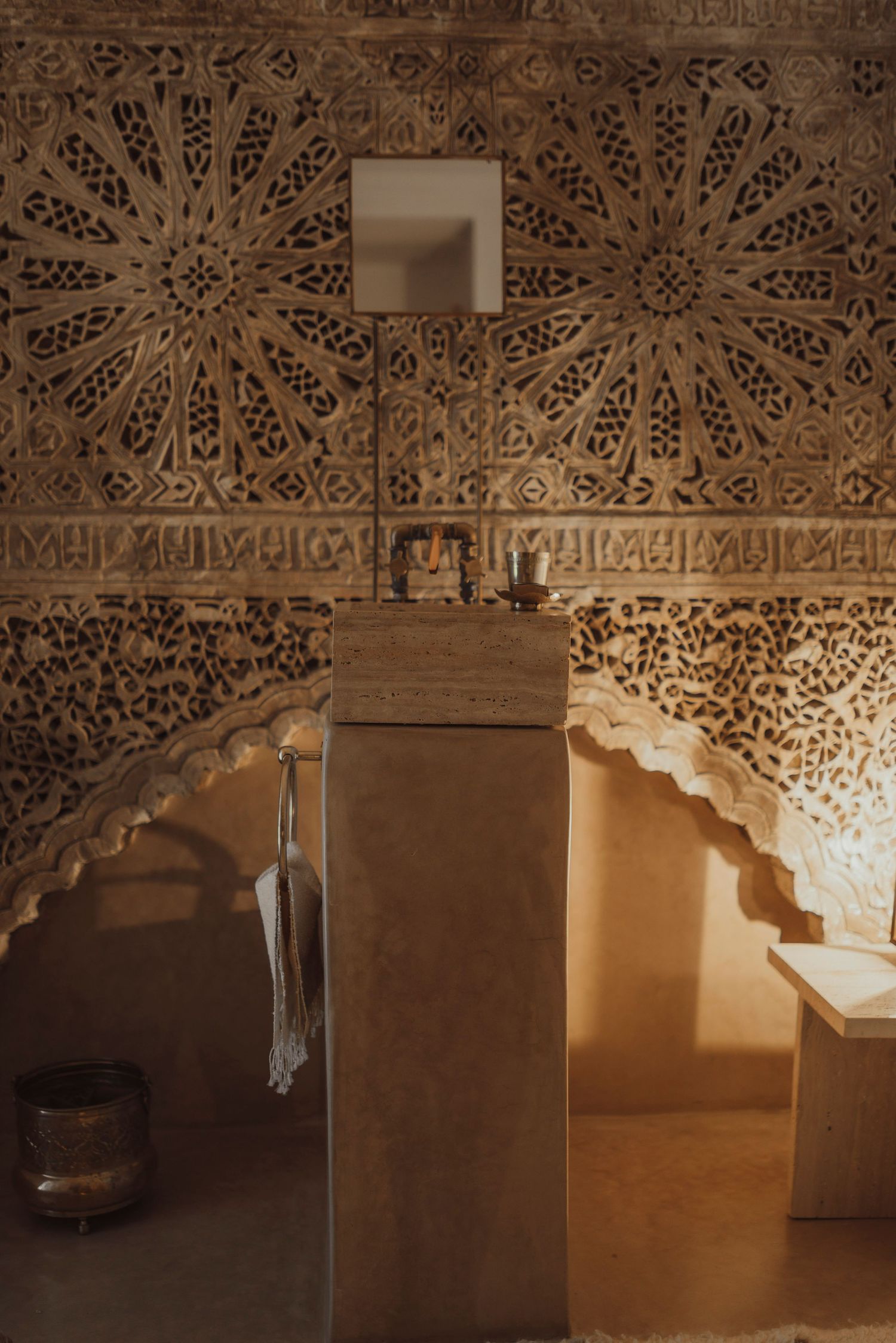 Ornate Islamic architectural details with intricate geometric patterns and carved stone work.