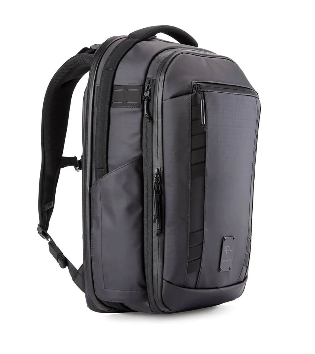 Grey professional camera backpack with ergonomic design and multiple pockets.