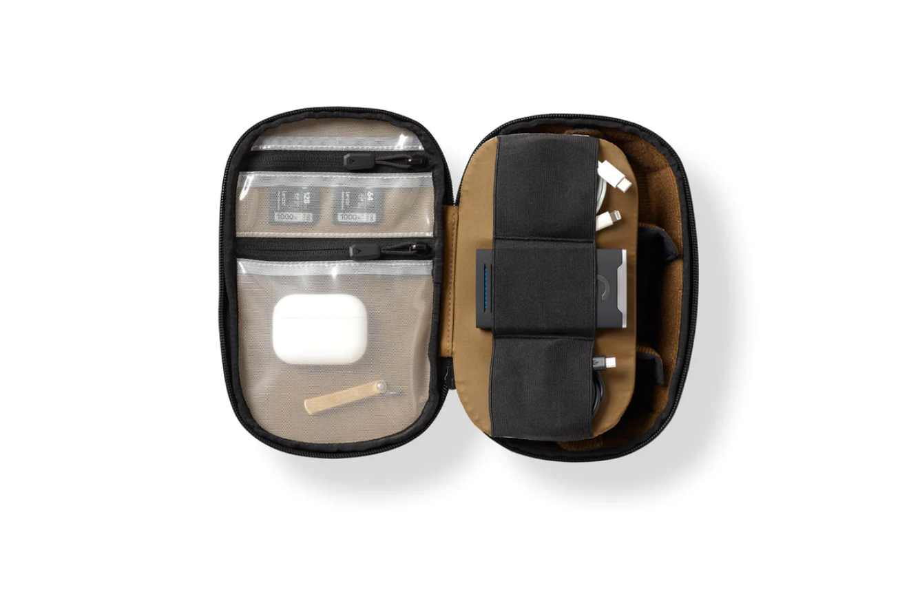 Small travel tech organizer case showing multiple storage pockets and mesh compartments.
