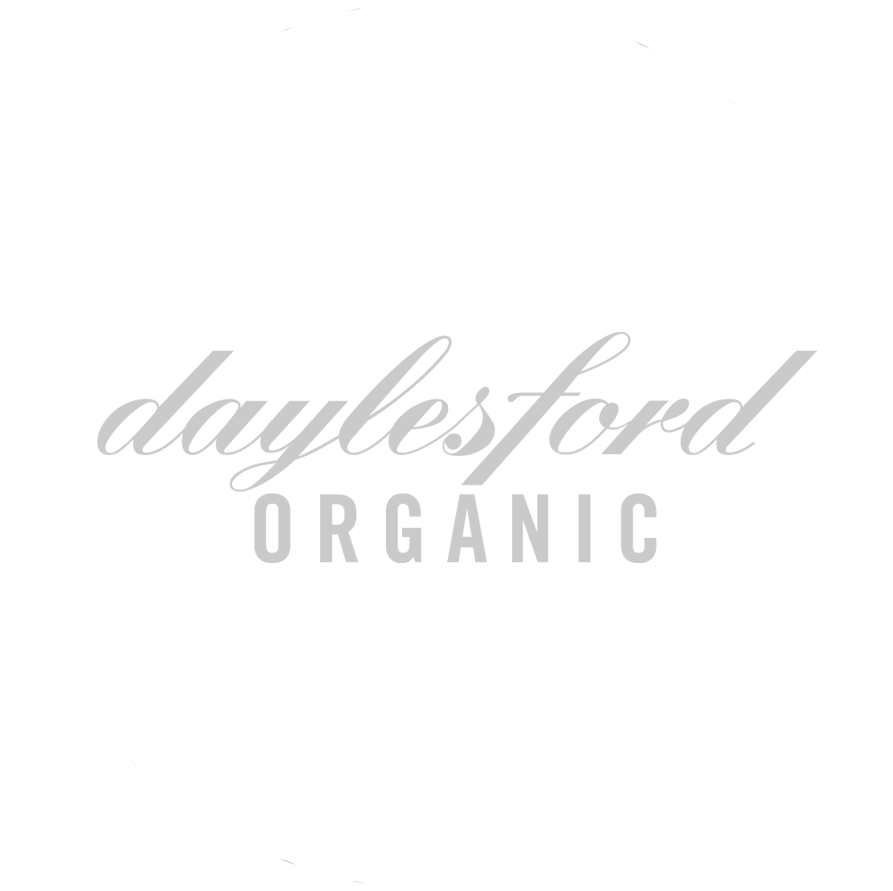 Daylesford Organic company logo in light gray text using a stylized cursive font for the wordmark design.