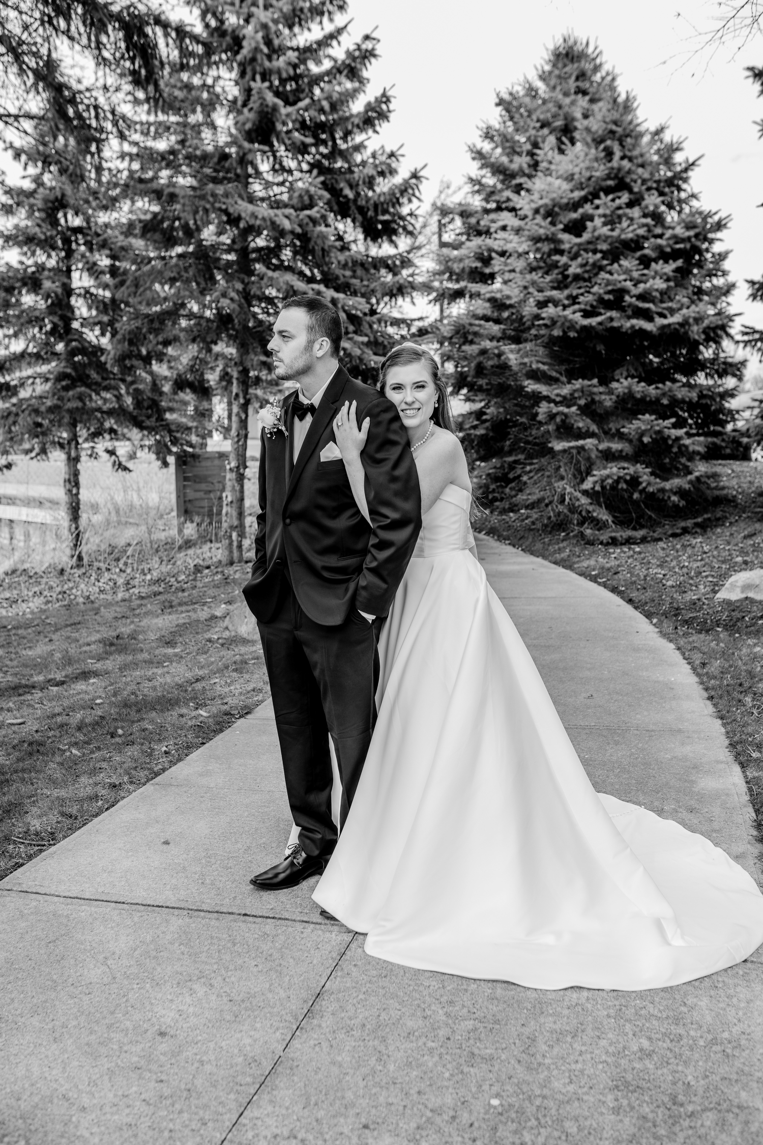 Black and white wedding photo of bride and groom posing for michigans best mid mivhigane wedding photographer