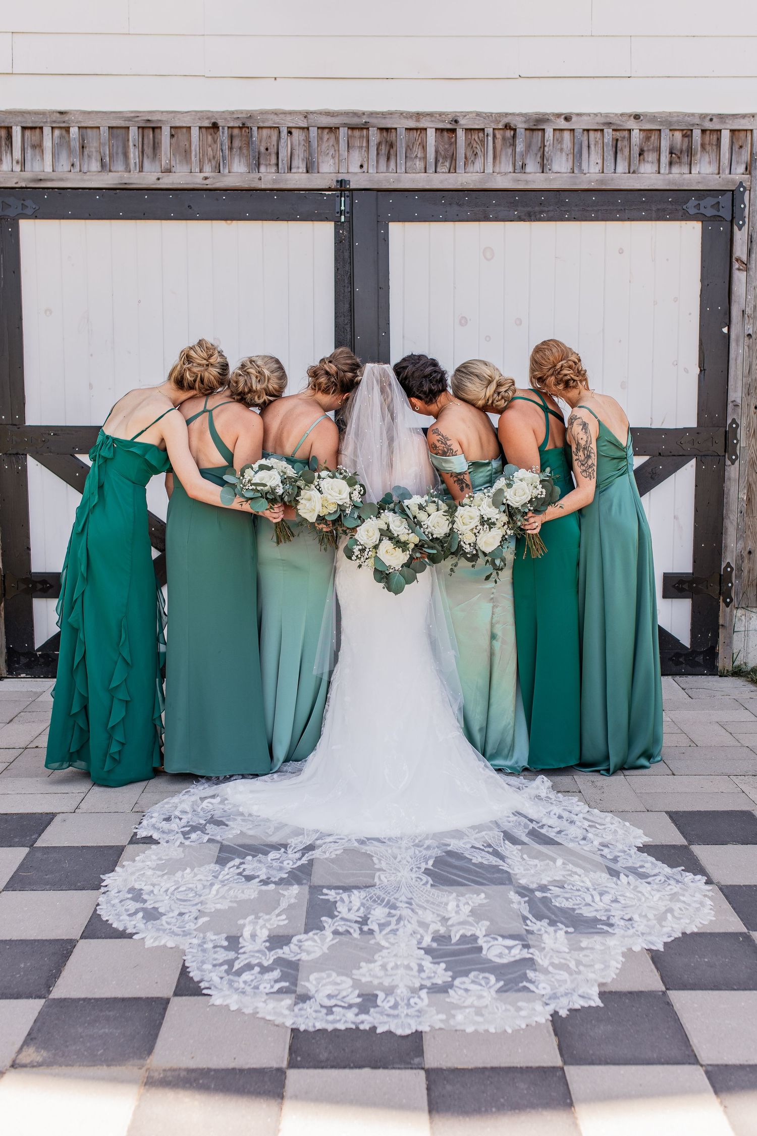 Wedding party posing for mid michigans best local wedding photographer in grand rapids, west side of state at beautiful wedding venue