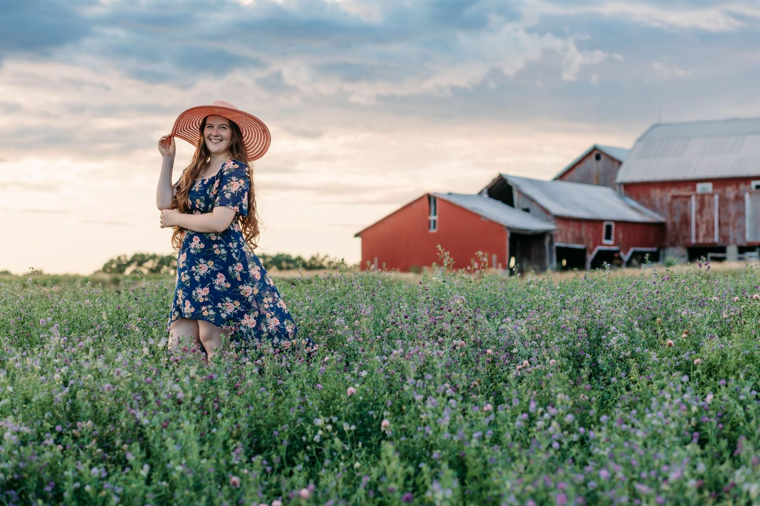 Senior girl on her familys dairy farm, posing for her senior portraits, mayville, mid michigans best senior photographer
