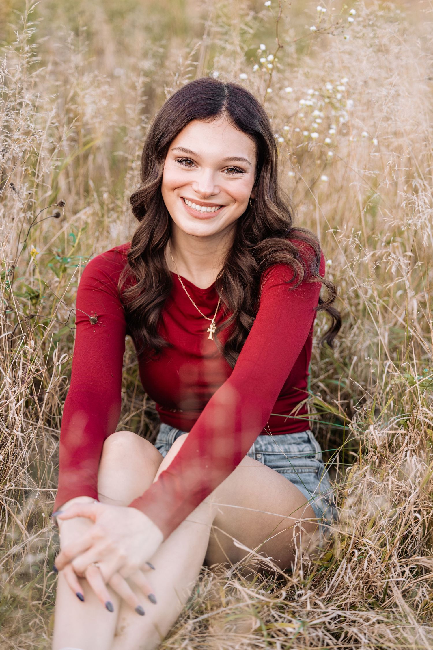 Senior portrait taken in flower field, in mid michigans favorite parks, local senior photographer