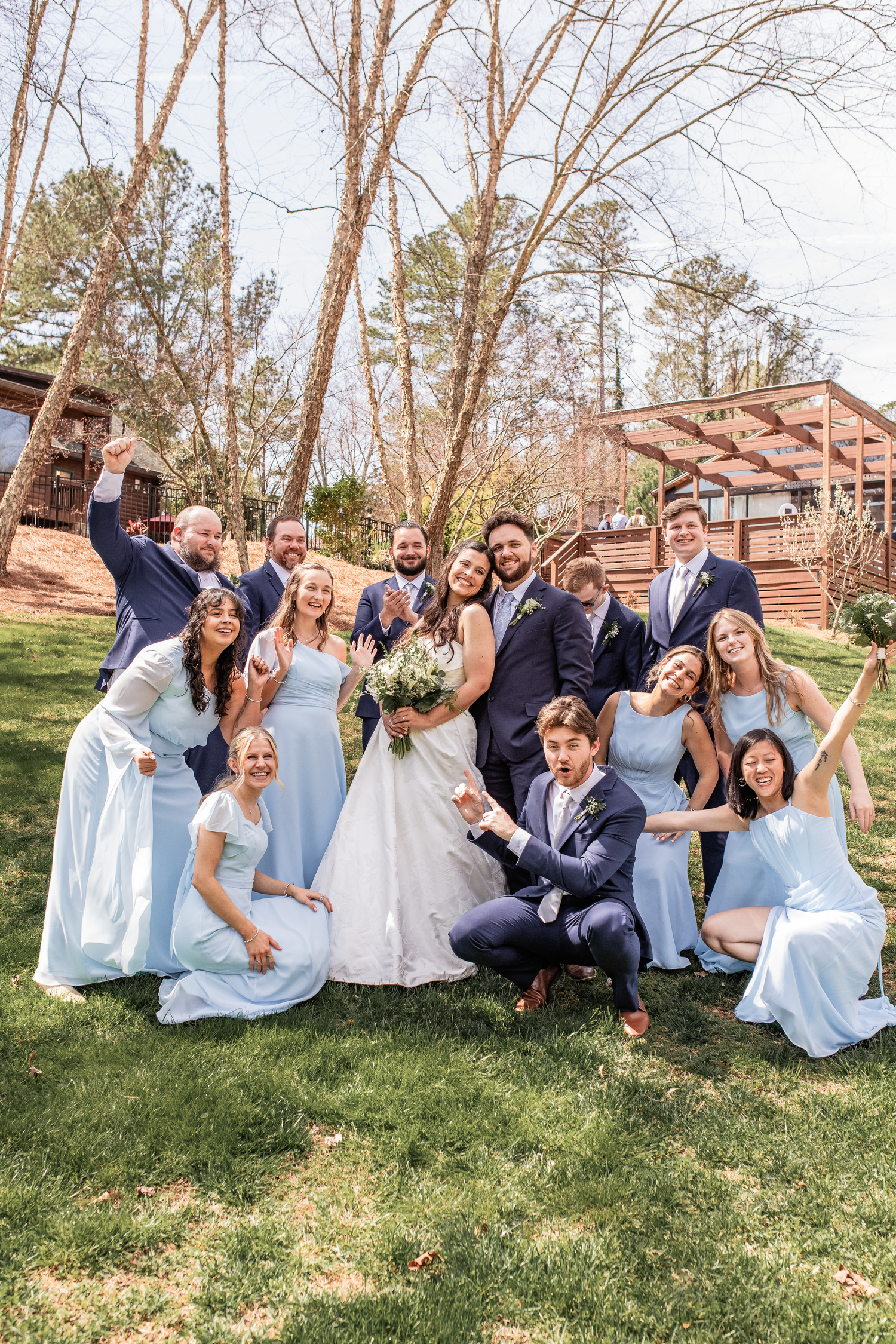 Wedding party posing outdoors in Atlanta, Mid michigan wedding photographer flys out of state