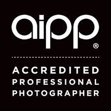 AIPP Accredited Professional Photographer logo in white text on black background.