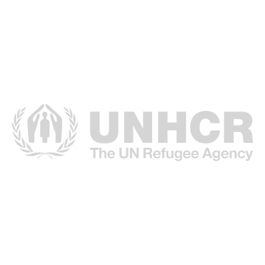 UNHCR logo, the UN Refugee Agency, featuring a stylized tent surrounded by laurel wreath in gray monochrome design.