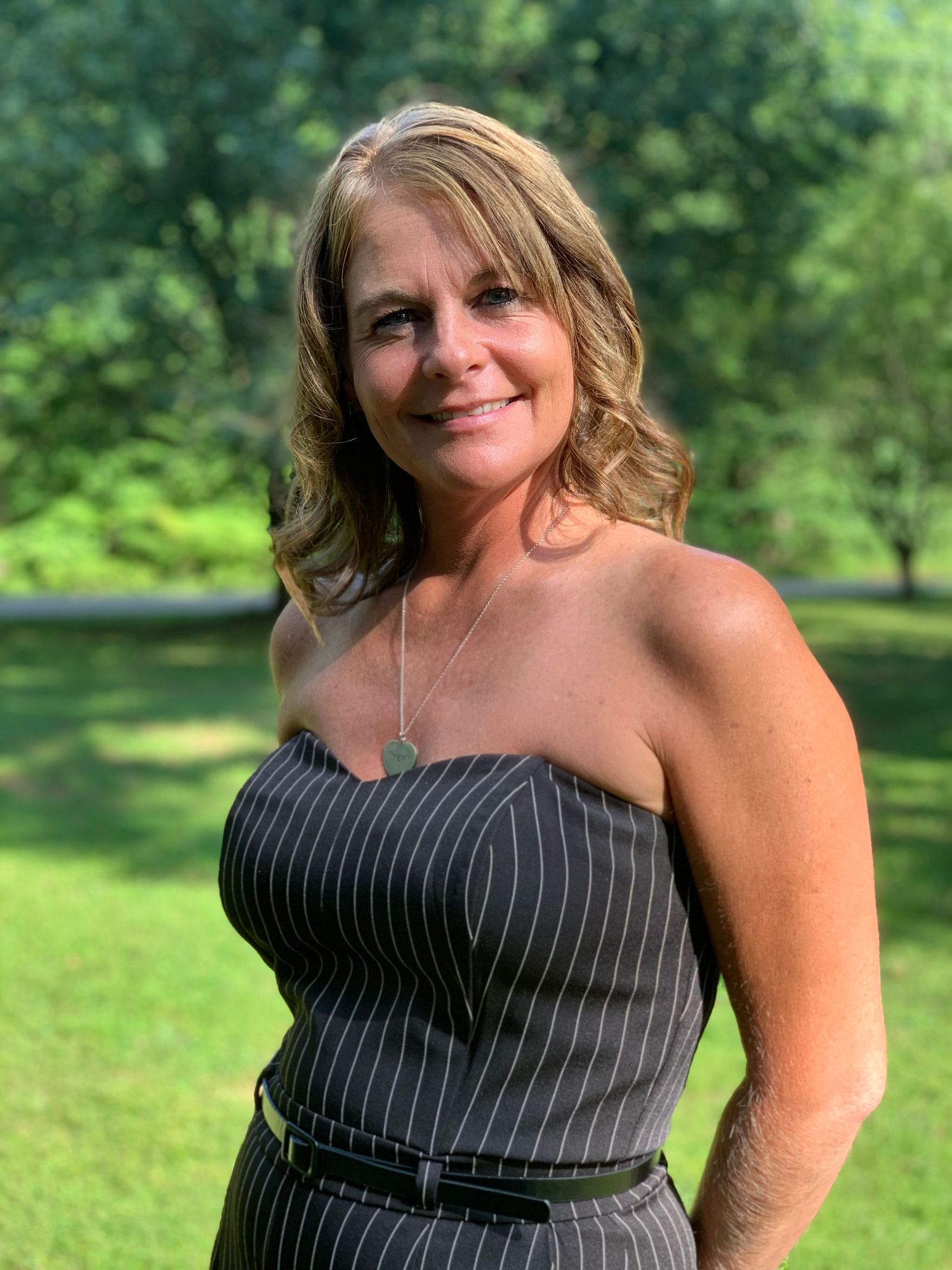 Outdoor portrait of a woman in a natural green setting