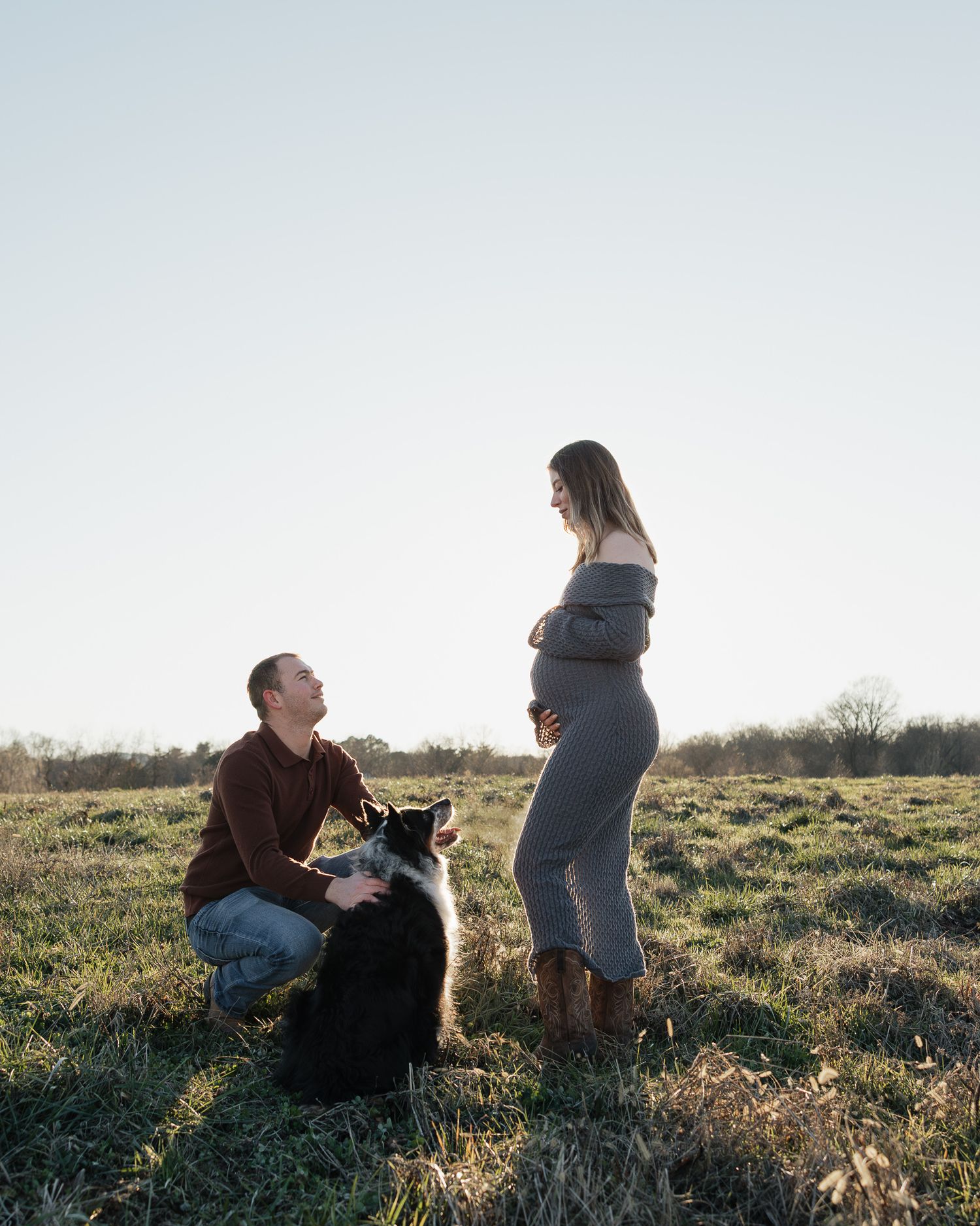 A couple sits together in a grassy field at sunset, sharing tender moments across multiple romantic poses.