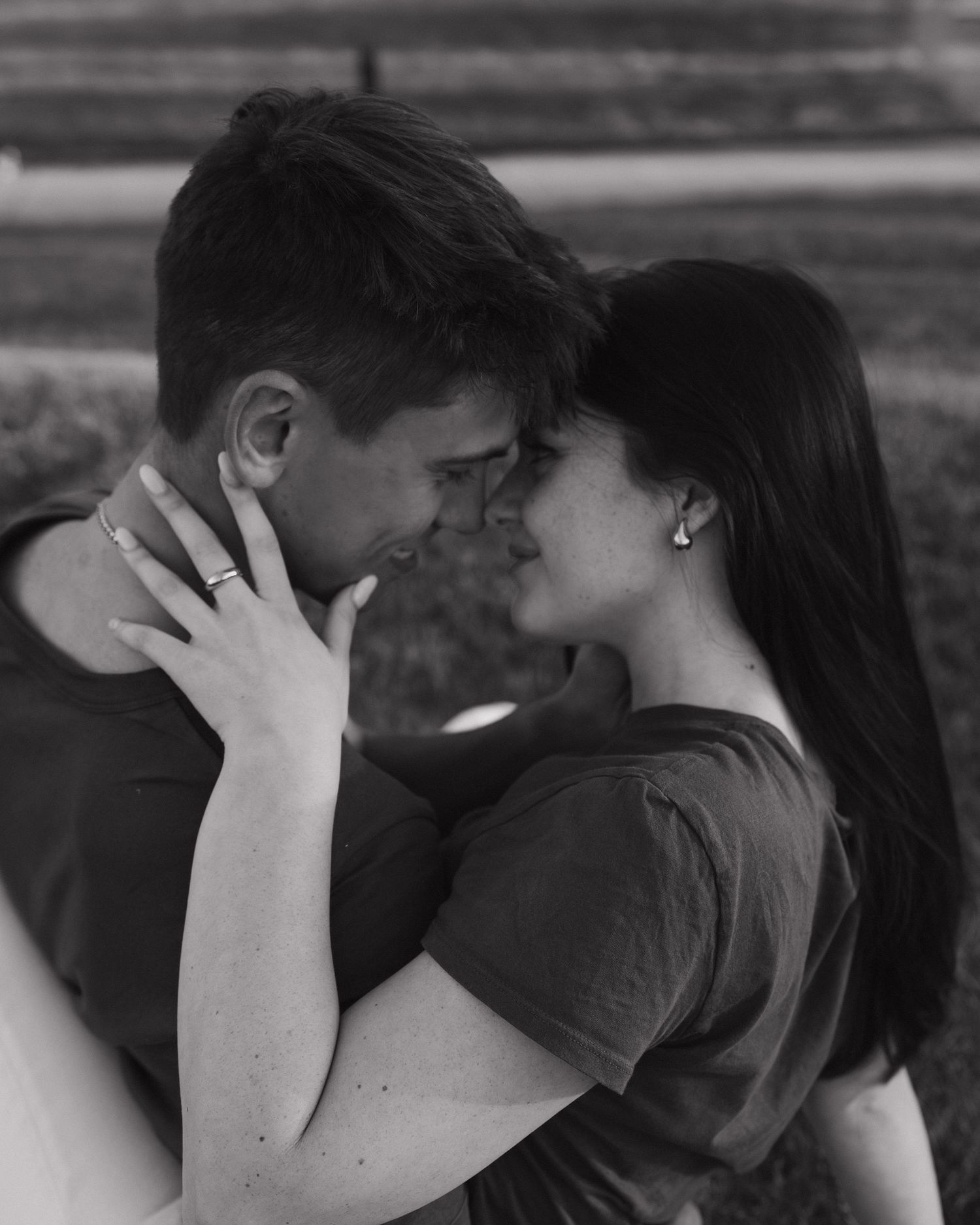 Black and white romantic portrait of couple sharing tender moment.