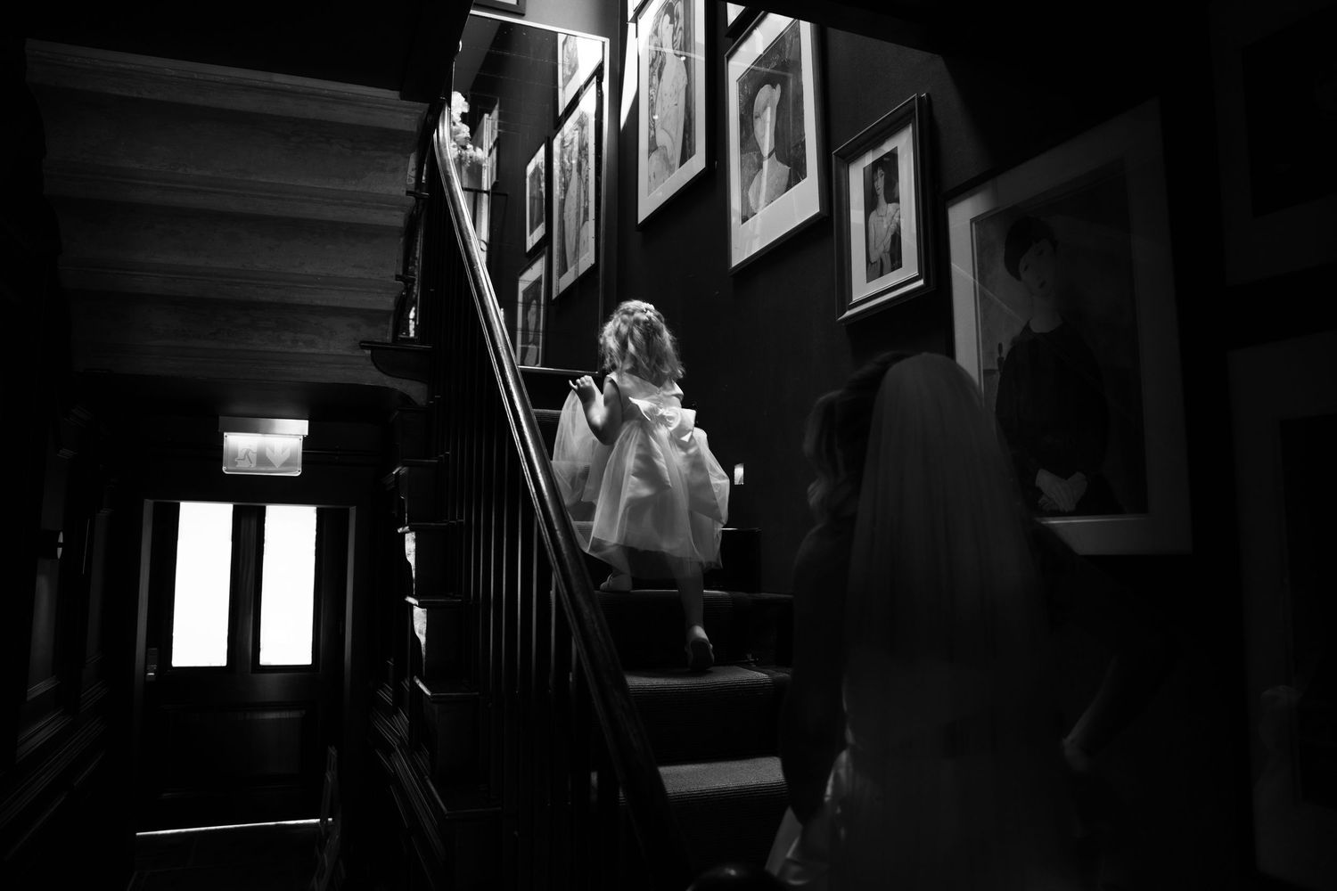Beautiful moments of bride with flower girl at Manor House Lindley by Manchester wedding photographer Tina Hevingham.