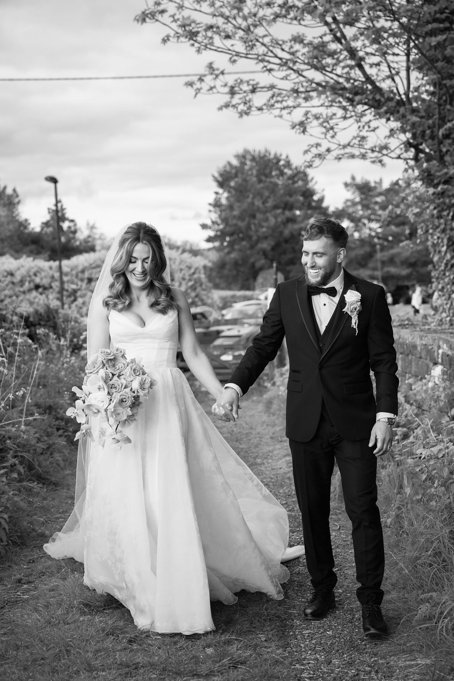 Romantic walks with bride and groom at The White Hart in Saddleworth by Tina Hevingham Manchester wedding photographer.