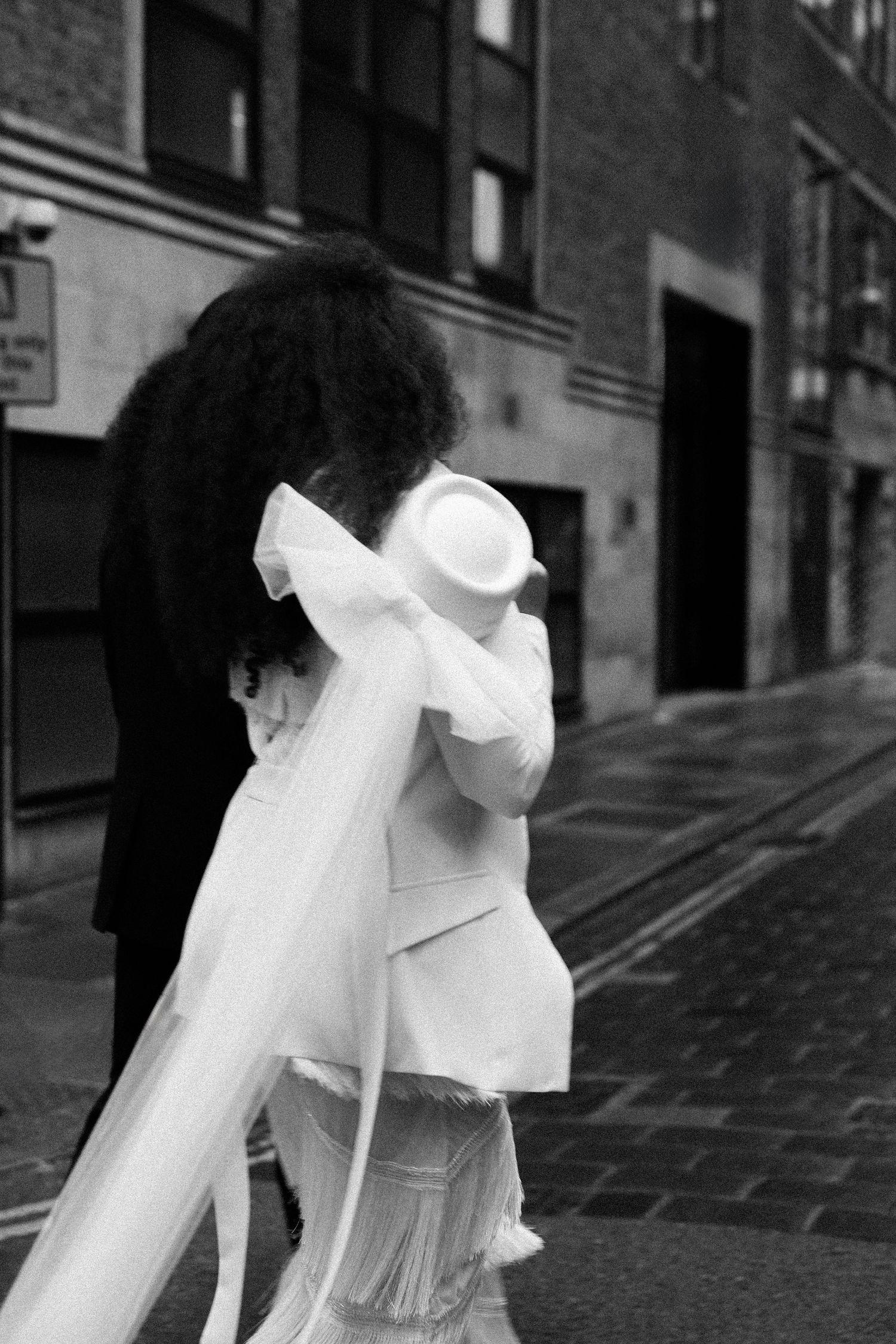 Natural moments of city elopement captured by Manchester wedding photographer.