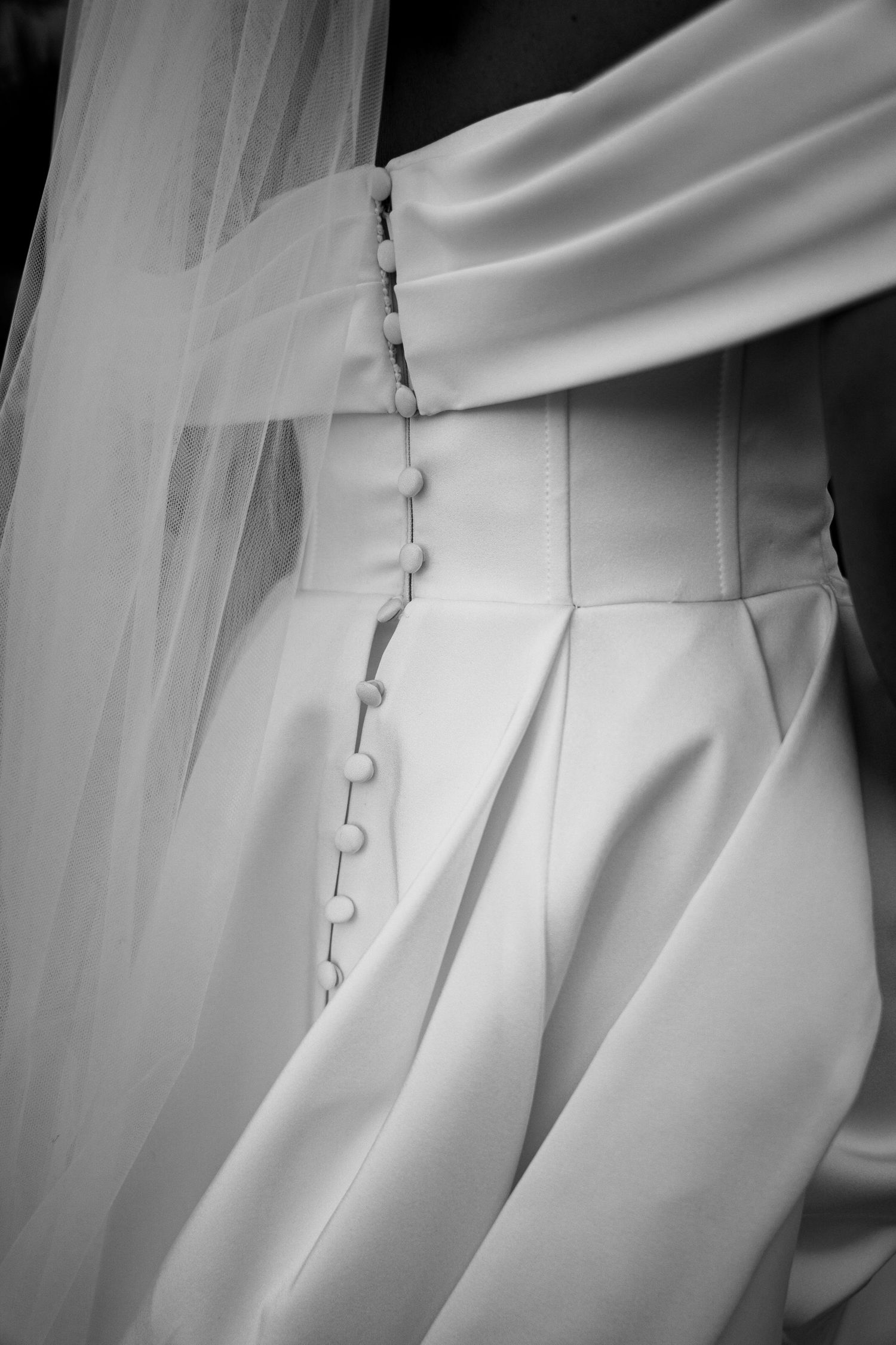 Brides dress documented in an editorial style by Manchester wedding photographer Tina Hevingham.