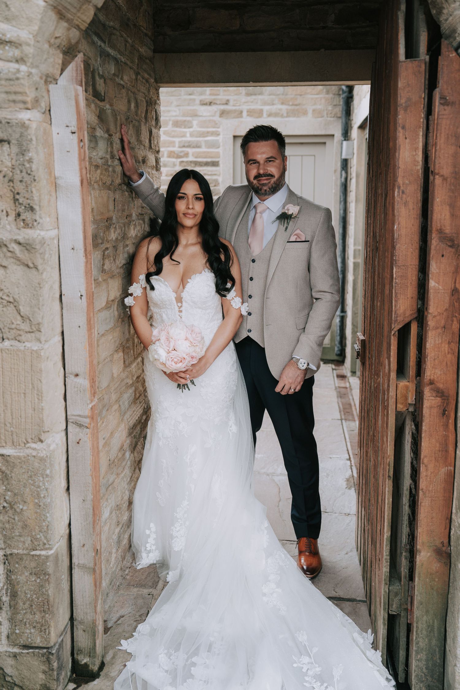 Couple relaxed and naturally  posed in Yorkshire country wedding, by Manchester wedding photographer.