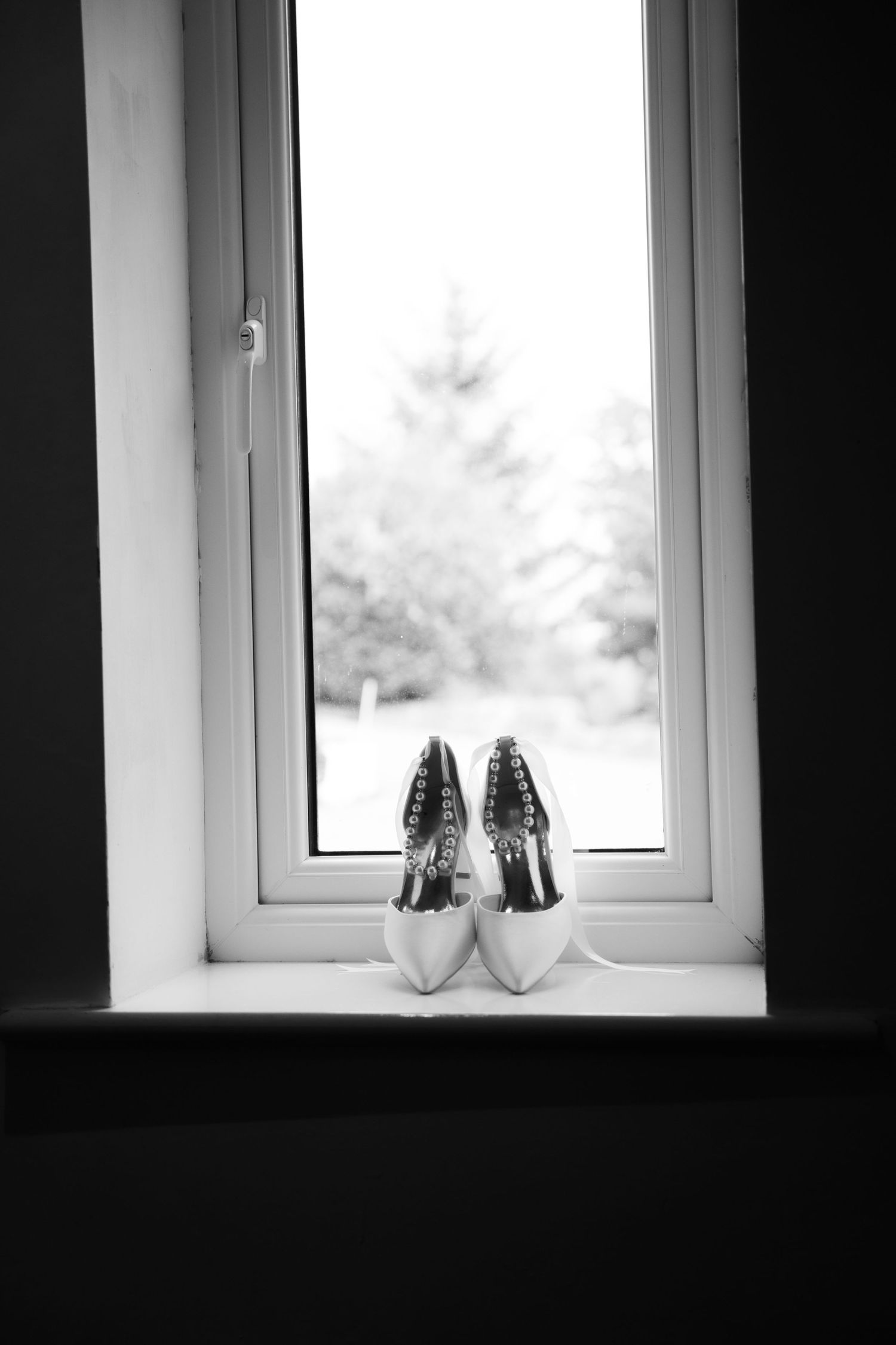 Brides wedding shoes, very important details at Grains Bar Hotel in Saddleworth by Manchester wedding photographer.